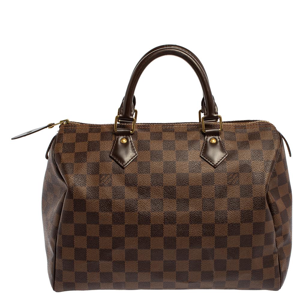 Titled as one of the greatest handbags in the history of luxury fashion, the Speedy from Louis Vuitton was first created for everyday use as a smaller version of their famous Keepall bag. This Speedy comes crafted from Damier Ebene canvas with two