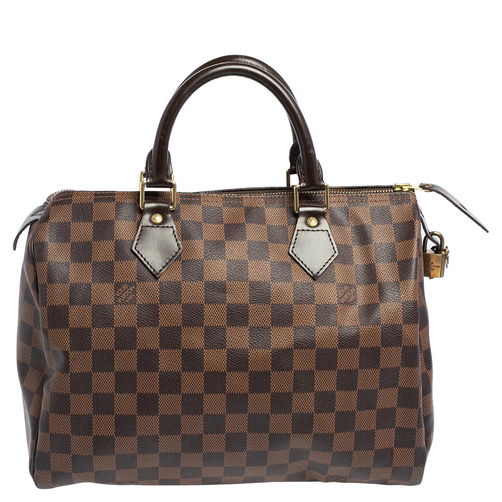 Titled as one of the greatest handbags in the history of luxury fashion, the Speedy from Louis Vuitton was first created for everyday use as a smaller version of their famous Keepall bag. This Speedy comes crafted from signature Damier Ebene coated