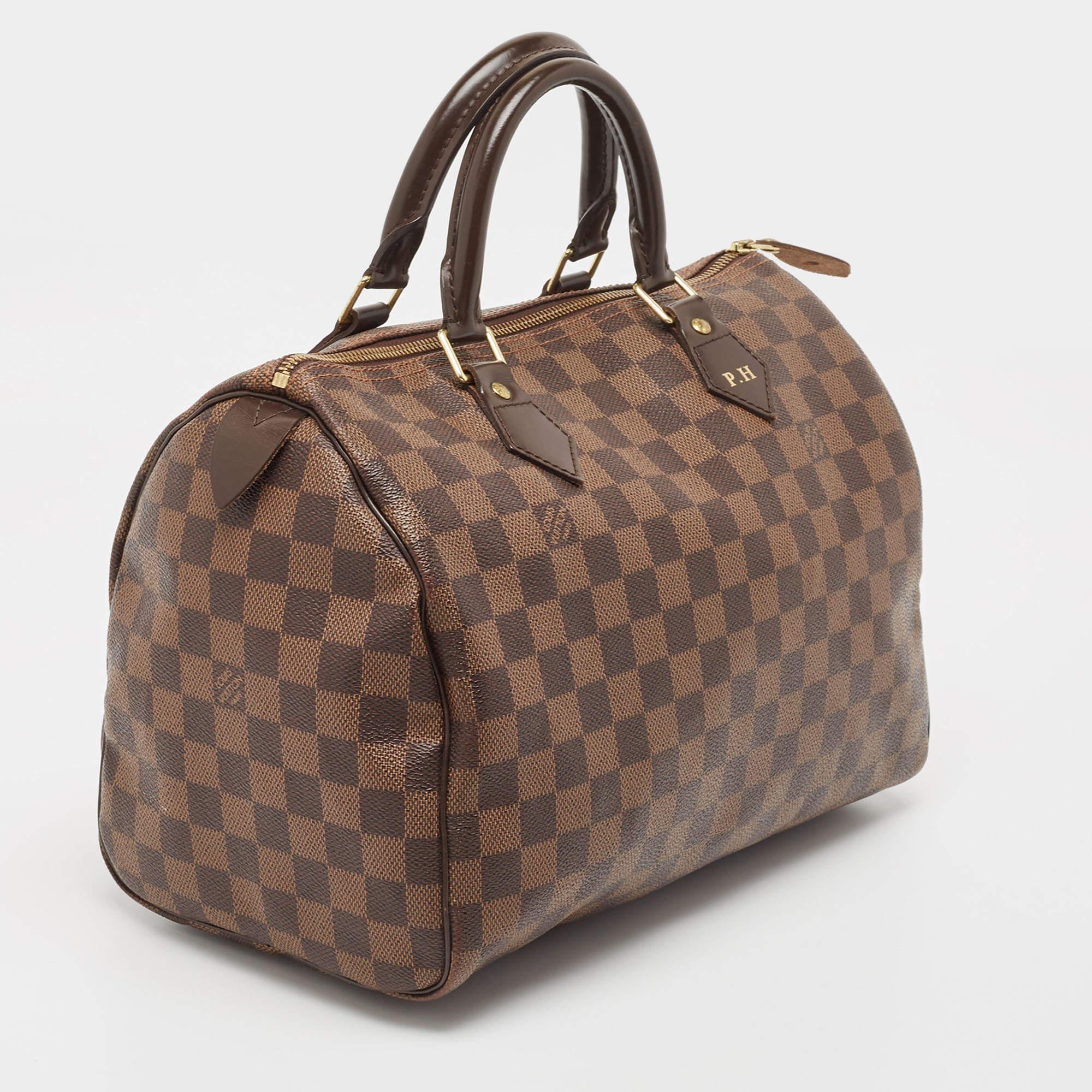 Titled as one of the greatest handbags in the history of luxury fashion, the Speedy from Louis Vuitton was first created for everyday use as a smaller version of their famous Keepall bag. This Speedy comes crafted from signature Damier Ebene coated