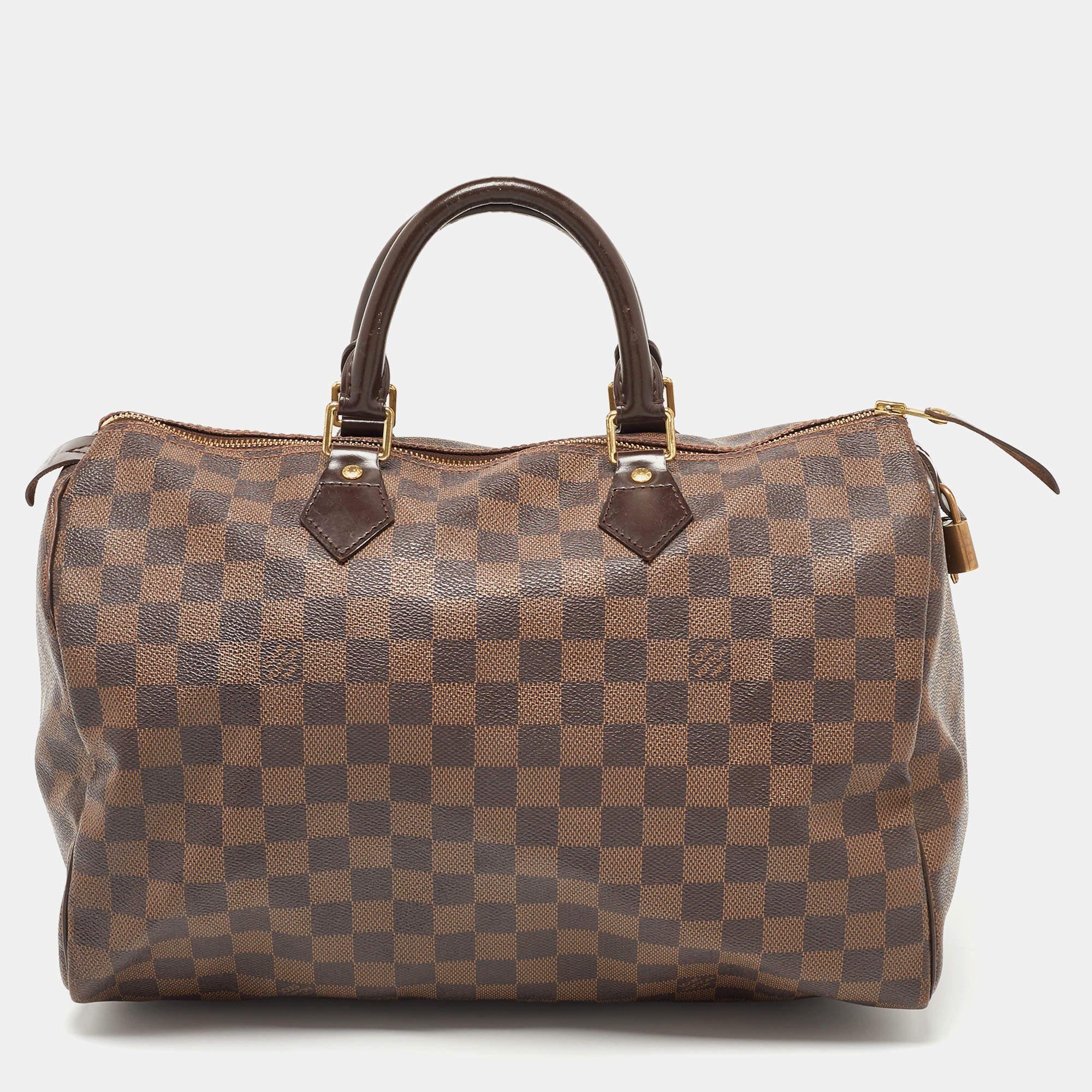 Regarded as one of the greatest handbags in the history of luxury fashion, the Speedy from Louis Vuitton was first created for everyday use as a smaller version of their famous Keepall bag. This Speedy comes crafted from Damier Ebene coated canvas