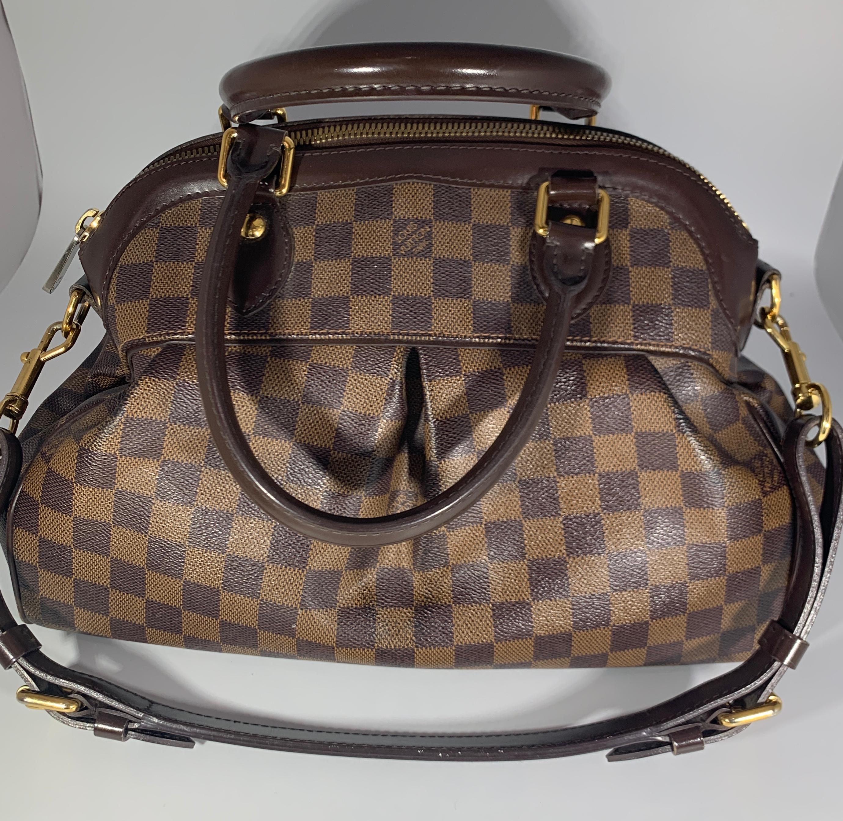 This is an authentic LOUIS VUITTON Trevi PM Bag. This beautiful satchel handbag is named after the entrancing Trevi Fountain in Rome, Italy. It's a beautifully designed petite handbag with a cinched detail on the front and sides. It features the