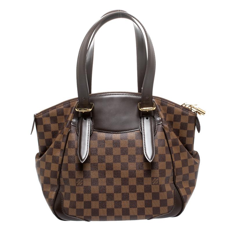 This Verona MM Bag, like all the other handbags from Louis Vuitton, is durable and stylish. Crafted from Damier Ebene canvas and leather, the bag comes with two handles and a top zipper that opens to reveal a spacious canvas interior with enough