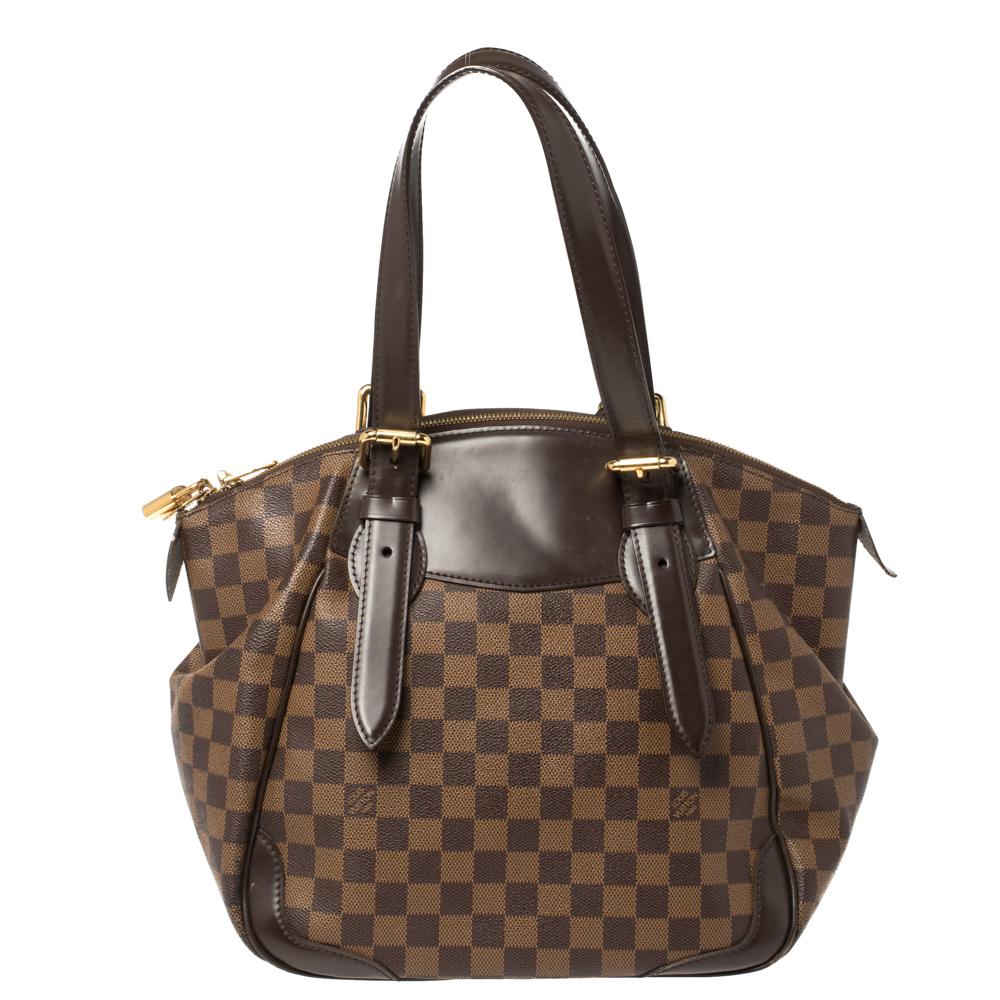 This Verona MM bag, like all the other handbags from Louis Vuitton, is durable and stylish. Crafted from Damier Ebene canvas and leather, the bag comes with two handles and a top zipper that opens to reveal a spacious canvas interior with enough