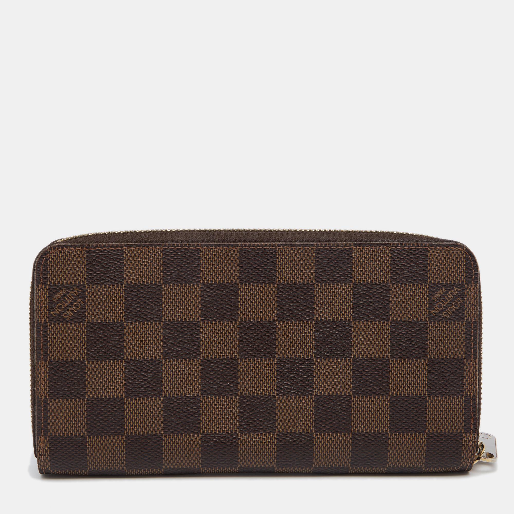This Louis Vuitton Zippy wallet is conveniently designed for everyday use. Crafted from coated canvas, the wallet has a zip-around closure that opens to reveal multiple slots and compartments for you to neatly arrange your cards.

Includes: Original