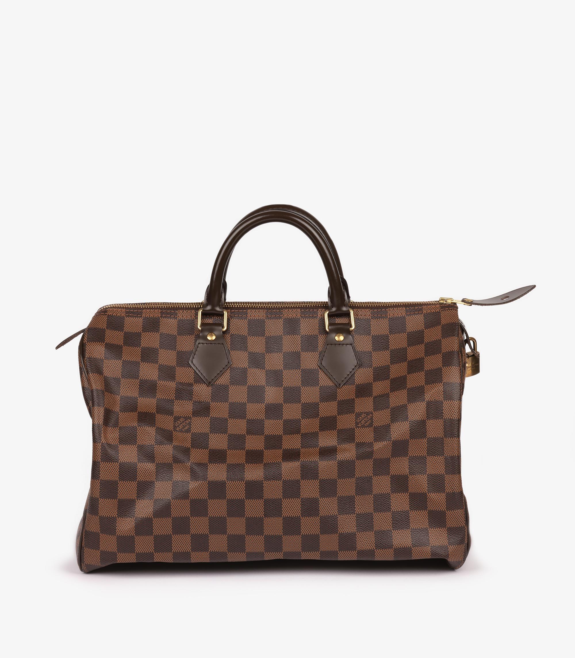Louis Vuitton Damier Ebene Coated Canvas & Brown Calfskin Leather Speedy 35

Brand- Louis Vuitton
Model- Speedy 35
Product Type- Tote
Serial Number- TR0193
Age- Circa 2013
Accompanied By- Louis Vuitton Box, Dust Bag
Colour- Brown
Hardware- Golden