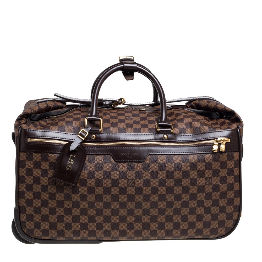 This timeless Louis Vuitton Monogram Canvas Eole 50 Rolling Luggage Bag is the ultimate carry-on. Made with high-end craftsmanship and a sleek design, the Damier Ebene coated canvas exterior features leather trim and has canvas lining. It is coupled
