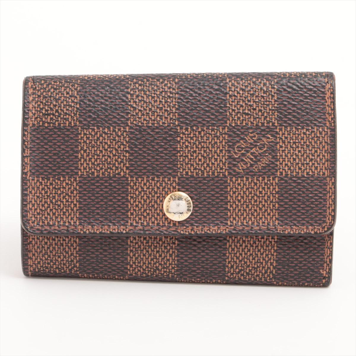 The Louis Vuitton Damier Ebene Multiclés 6 Key Case is a sleek and practical accessory that combines luxury with functionality. Crafted from the iconic Damier Ebene canvas, the key case features a classic brown checkered pattern that exudes timeless