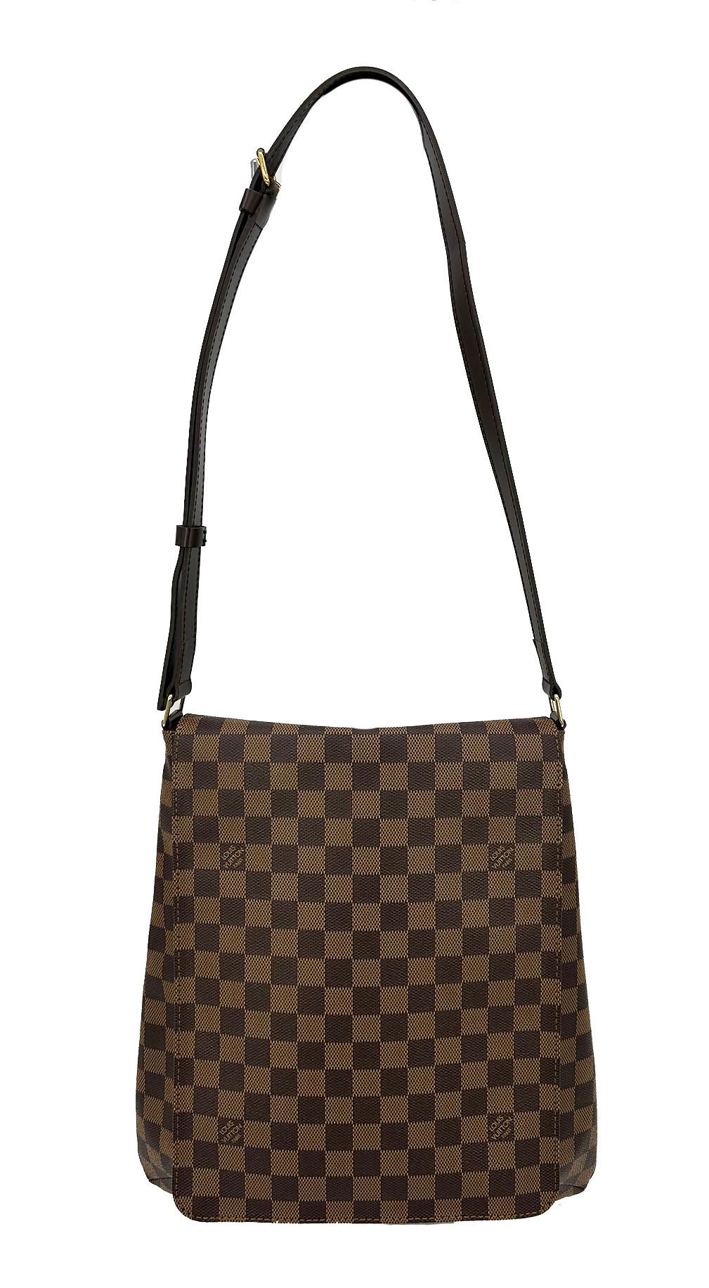 Louis Vuitton Damier Ebene Musette Salsa GM Shoulder Bag in very good condition. Dark brown checkered damier ebene canvas with signature Louis Vuitton logo throughout. Dark brown leather and gold brass hardware. adjustable leather shoulder strap