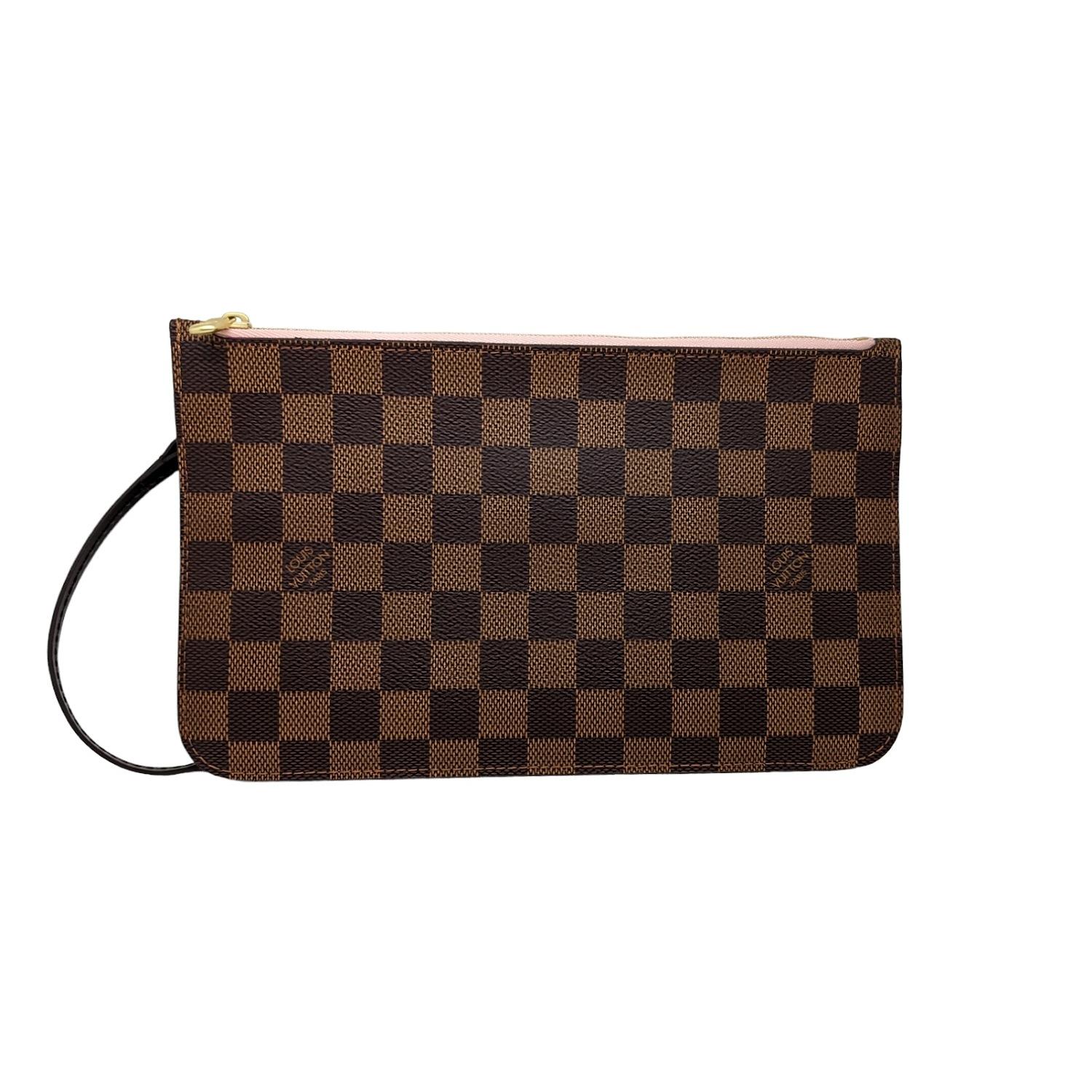 Louis Vuitton Damier Ebene Neverfull MM GM Pochette. This pochette is featured in signature Louis Vuitton checkered damier canvas. It includes a brown leather wristlet and a polished gold top zipper that opens to a ballerina pink striped fabric