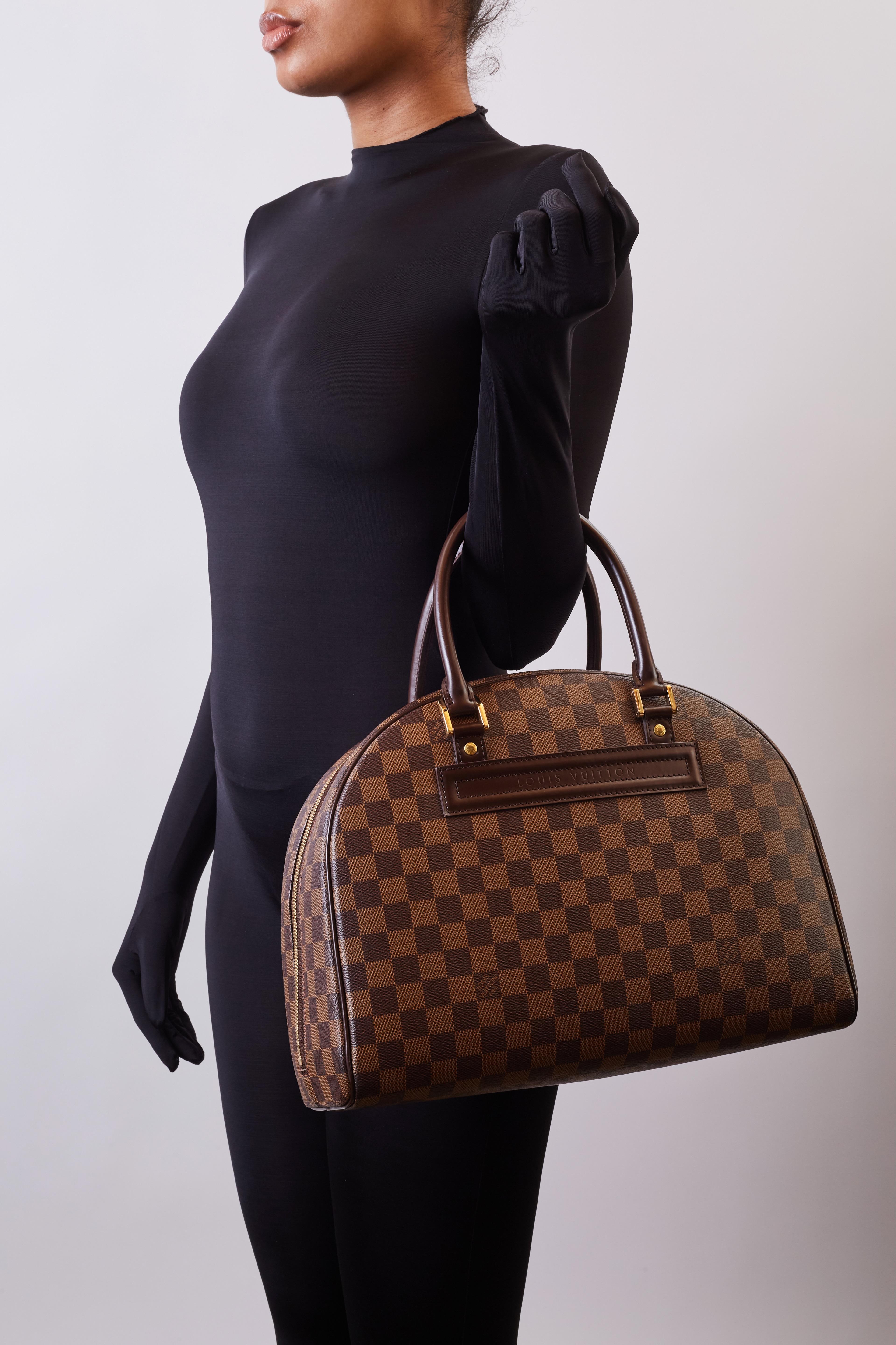 Color: Brown Damier Ebene
Material: Coated canvas with leather finishes
Date Code: SP1014
Measures: H 13” x L 17” x D 7”
Drop: 4”
Comes with: Dust bag
Condition: Good. Leather is pealing from one of the rolled top handles. Light interior  residue