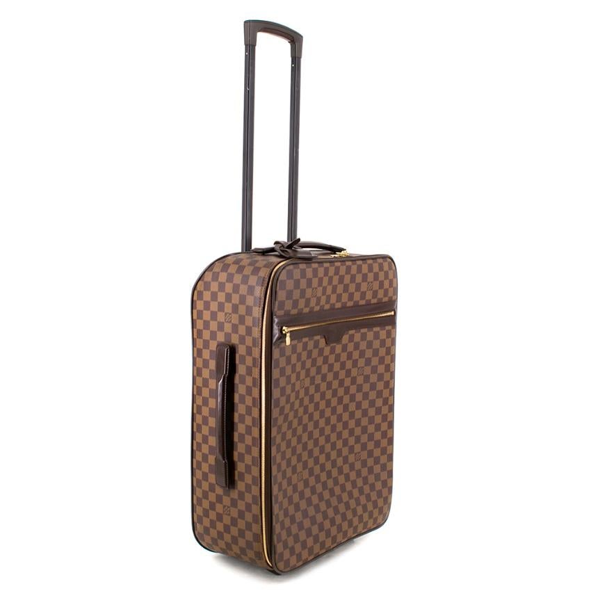 Louis Vuitton Monogram Pegase Legere 55 Suitcase in Damier Ebene Canvas exterior. Top and Side handle with double zip closure and front zipped pocket. Polyamide lining with two additional internal zipped pockets. Dark Leather Name tag also