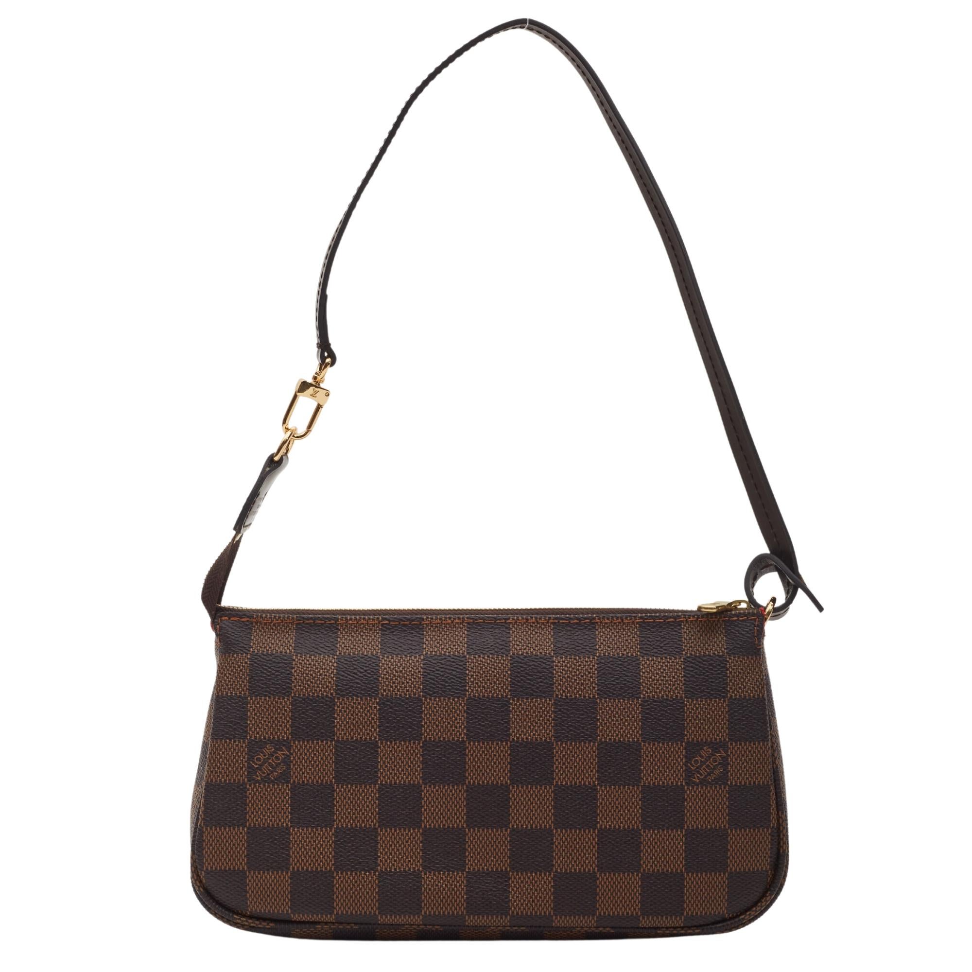 Color: Brown/ Damier ebene
Material: Coated canvas with brown leather finishes.
Date Code: CF0271
Measures: H 4.5” x L 9