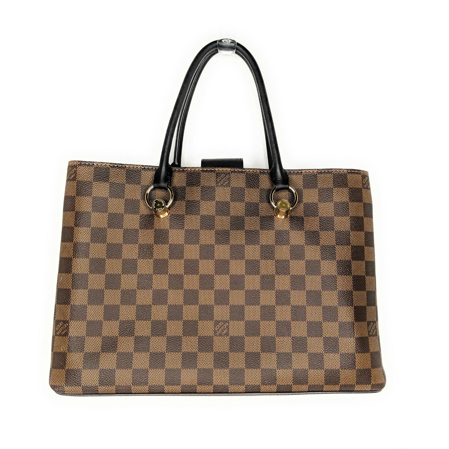 From the 2020 Collection. Brown and tan Damier Ebene coated canvas Louis Vuitton Riverside bag with brass hardware, dual rolled top handles, debossed logo and logo charm at front, black leather trim, protective feet at base, tonal Alcantara lining,