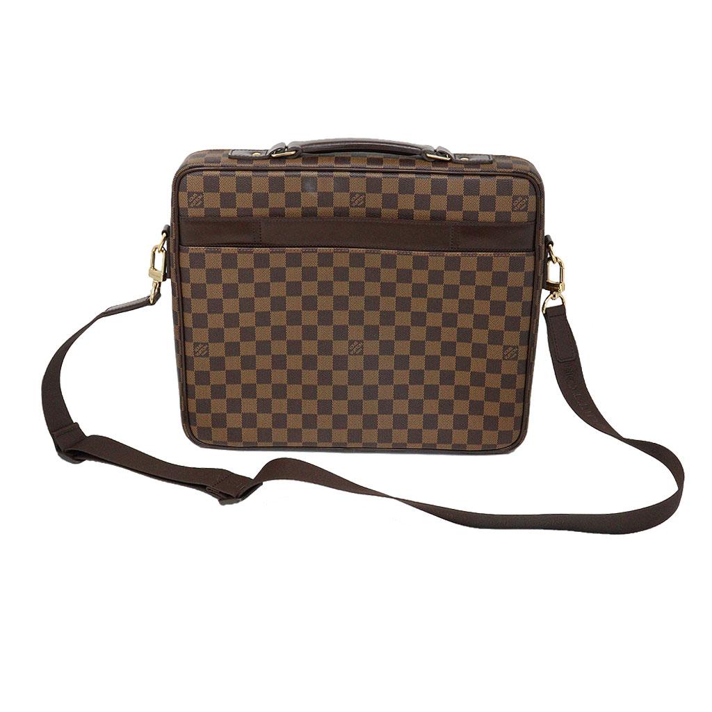Brand: Louis Vuitton
Style: Briefcase
Handles: Brown Canvas adjustable shoulder strap, 1.5