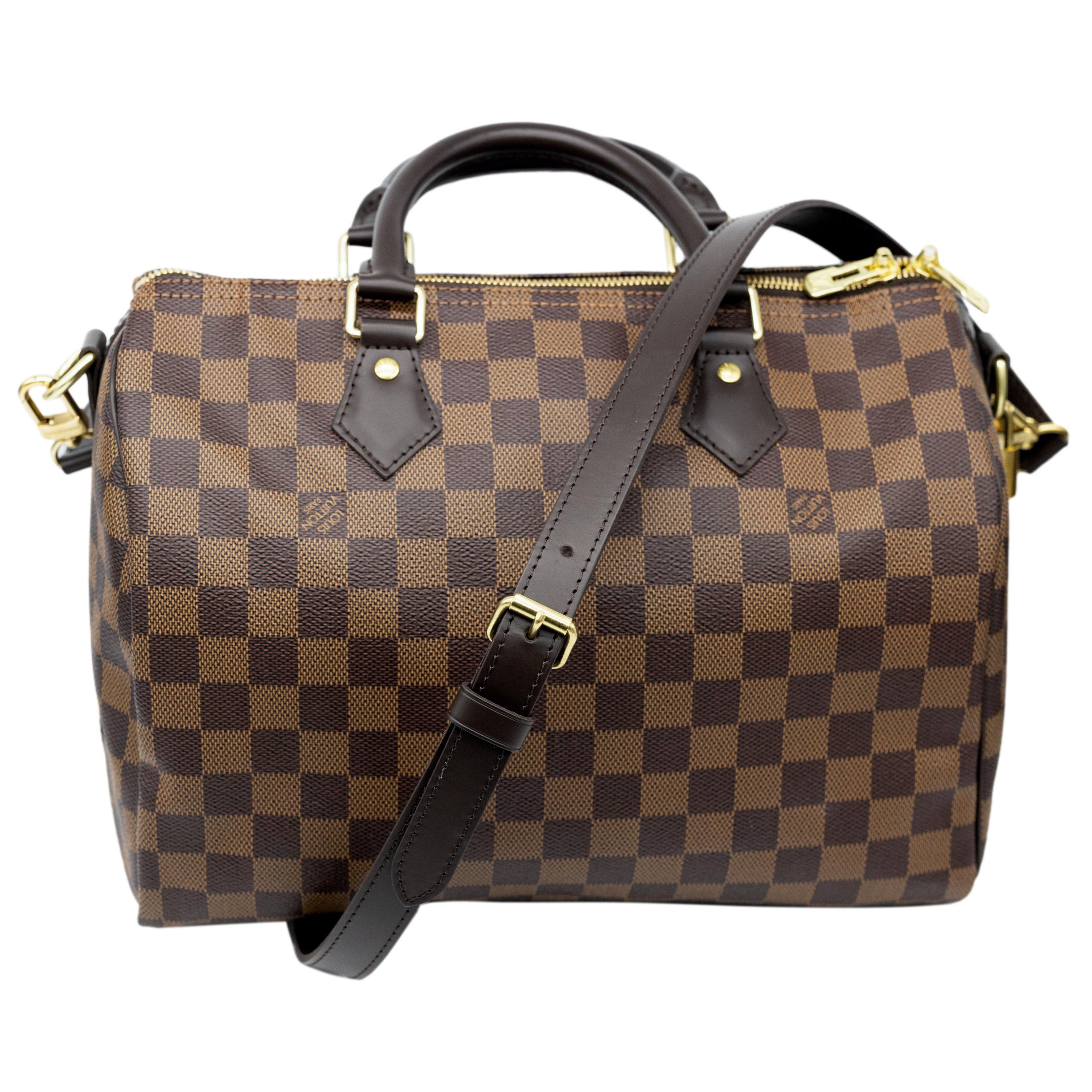 Louis Vuitton Damier Ebene Speedy 30 Bandoulière Top Handle Bag, USA 2019. This iconic speedy was first introduced in the 1930's and was designed as an alternative for the larger 