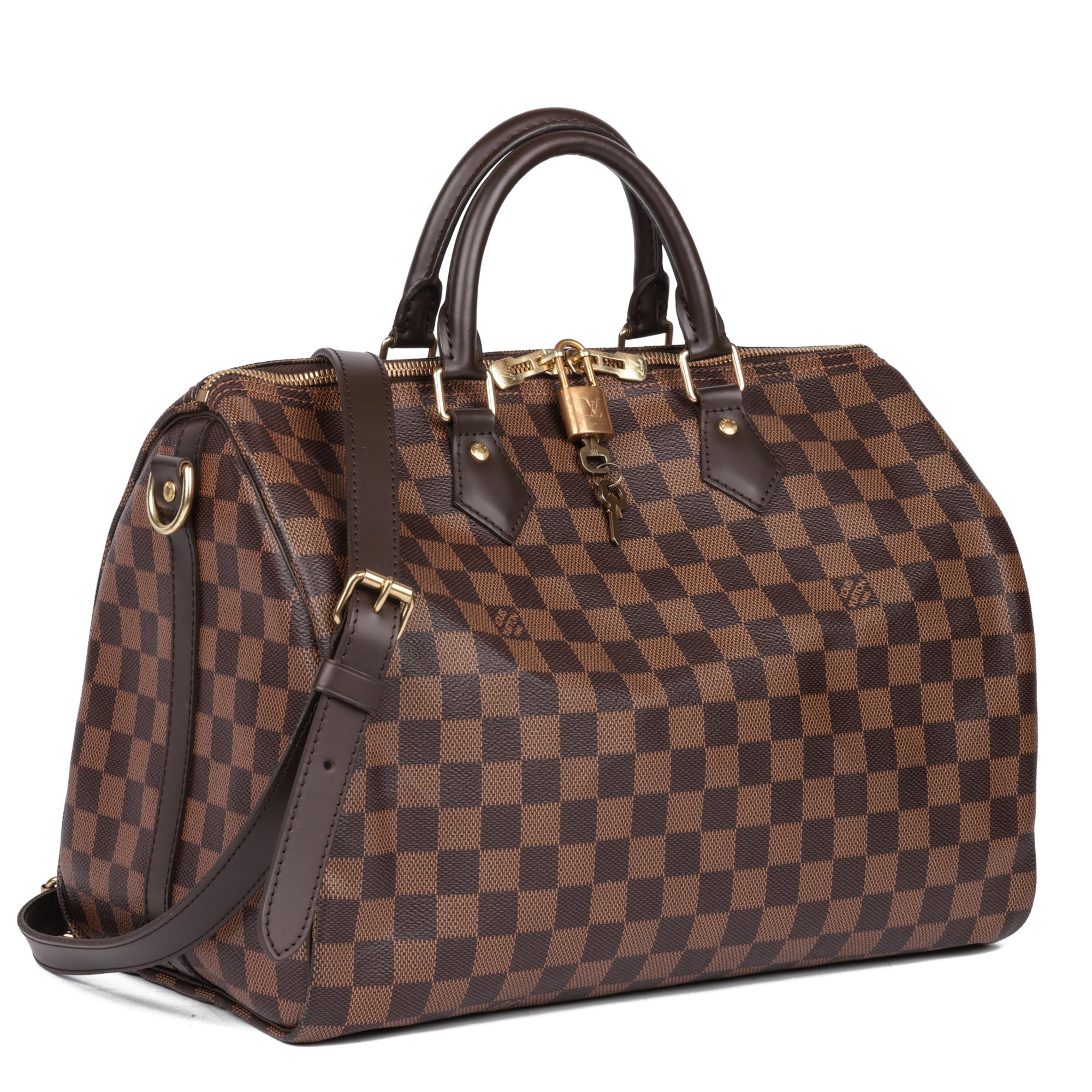 LOUIS VUITTON
Damier Ebene Coated Canvas & Brown Calfskin Leather Speedy 35 Bandoulière

Xupes Reference: HB5108
Serial Number: LA4169
Age (Circa): 2019
Accompanied By: Louis Vuitton Dust Bag, Shoulder Strap, Padlock, Keys
Authenticity Details: Date