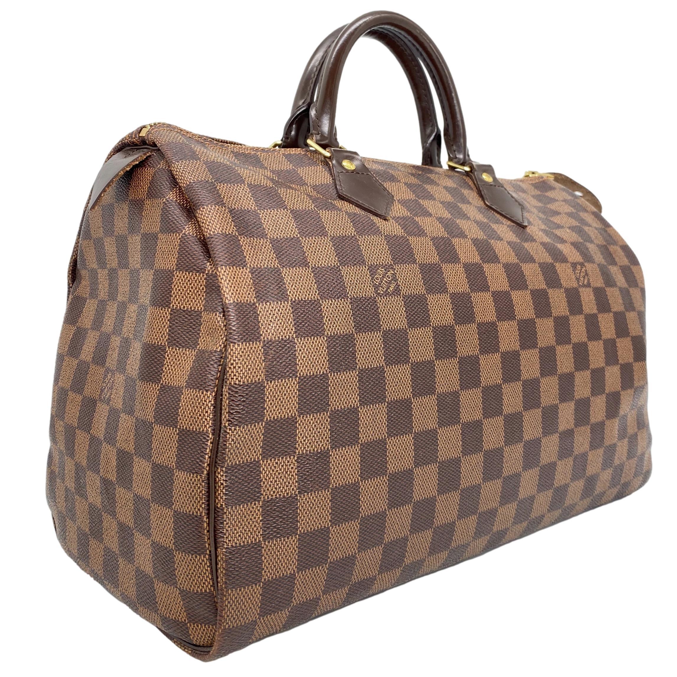 Louis Vuitton Damier Ebene Speedy 35 Top Handle Bag, France 2011. This iconic speedy was first introduced in the 1930's and was designed as an alternative for the larger 