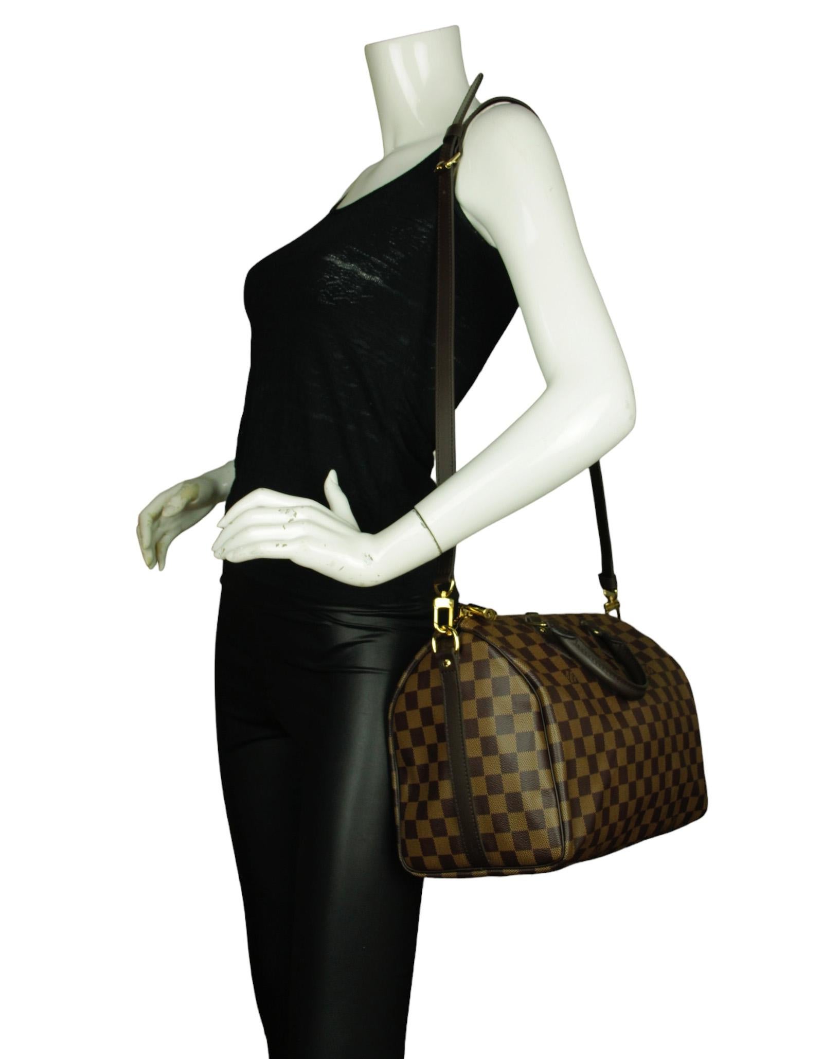 Borsa Louis Vuitton Damier Ebene Speedy Bandouliere 30

Prodotto in..: U.S.A.
Colore: marrone
Hardware: Oro
Materiali: Tela Coates con rifiniture in pelle
Fodera: Tessuto fine
Chiusura/apertura: Zip superiore
Tasche esterne: Nessuna
Tasche interne: