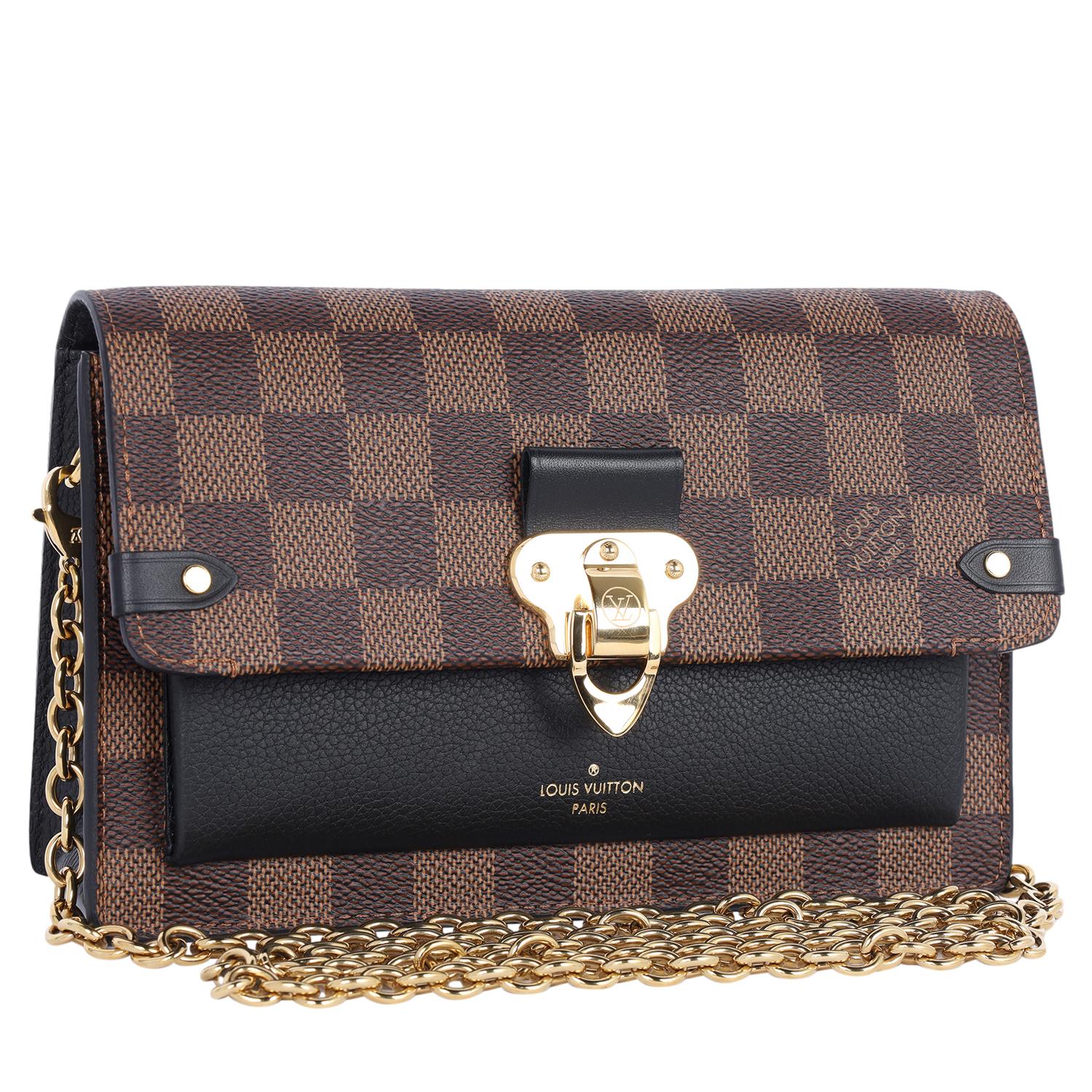 Authentic, pre-owned Louis Vuitton Vavin Pm in Brown Damier Ebene. This beautiful front flap style shoulder bag features Louis Vuitton Damier Ebene Canvas and leather in black, brass hardware, chain link strap that is removeable, magnetic closure.