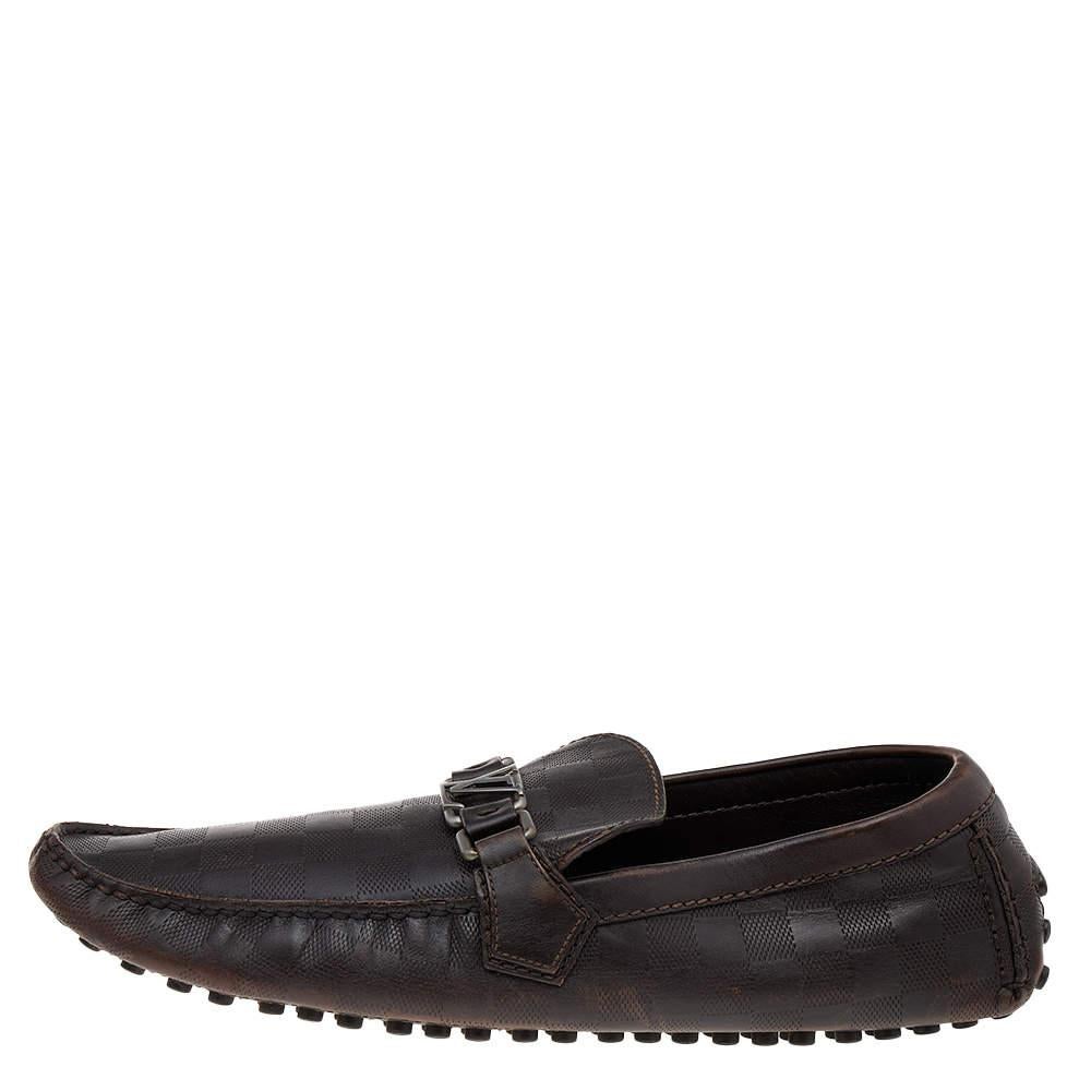 Loafers like these ones from Louis Vuitton are worth every penny because they epitomize both comfort and style. These Hockenheim loafers are made from dark-brown Damier embossed leather on the exterior with a silver-toned logo accent decorating
