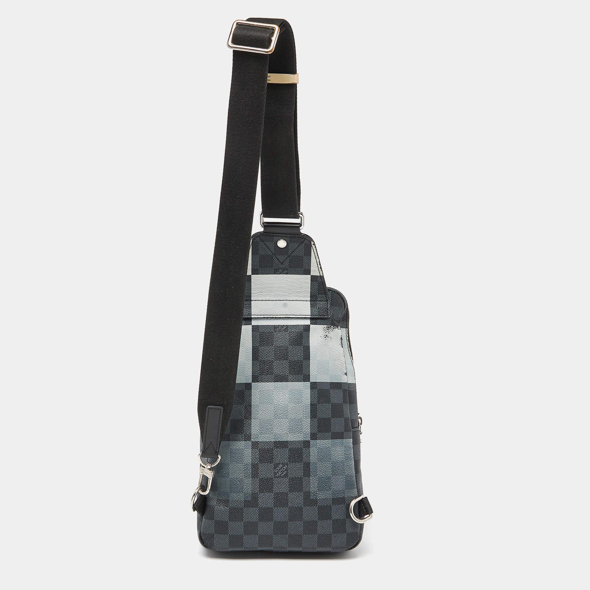 This Louis Vuitton bag will come in handy for daily use or as a style statement. It is crafted from Damier Graphite canvas and designed with a spacious interior secured by a zipper. A single crossbody strap and a front pocket make it ready to be