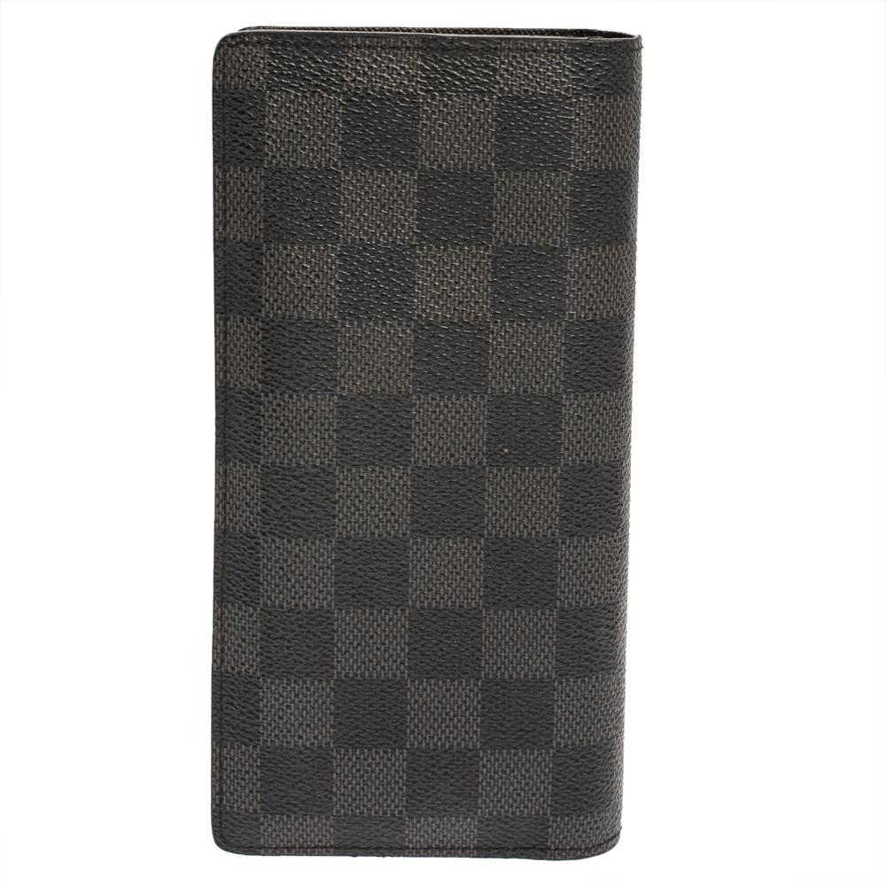 The Brazza wallet by Louis Vuitton will instantly become your favorite. It comes with multiple card slots, a zip pocket, and slip pockets. Made from the signature Damier Graphite canvas, the wallet is designed in a sleek shape to easily fit into