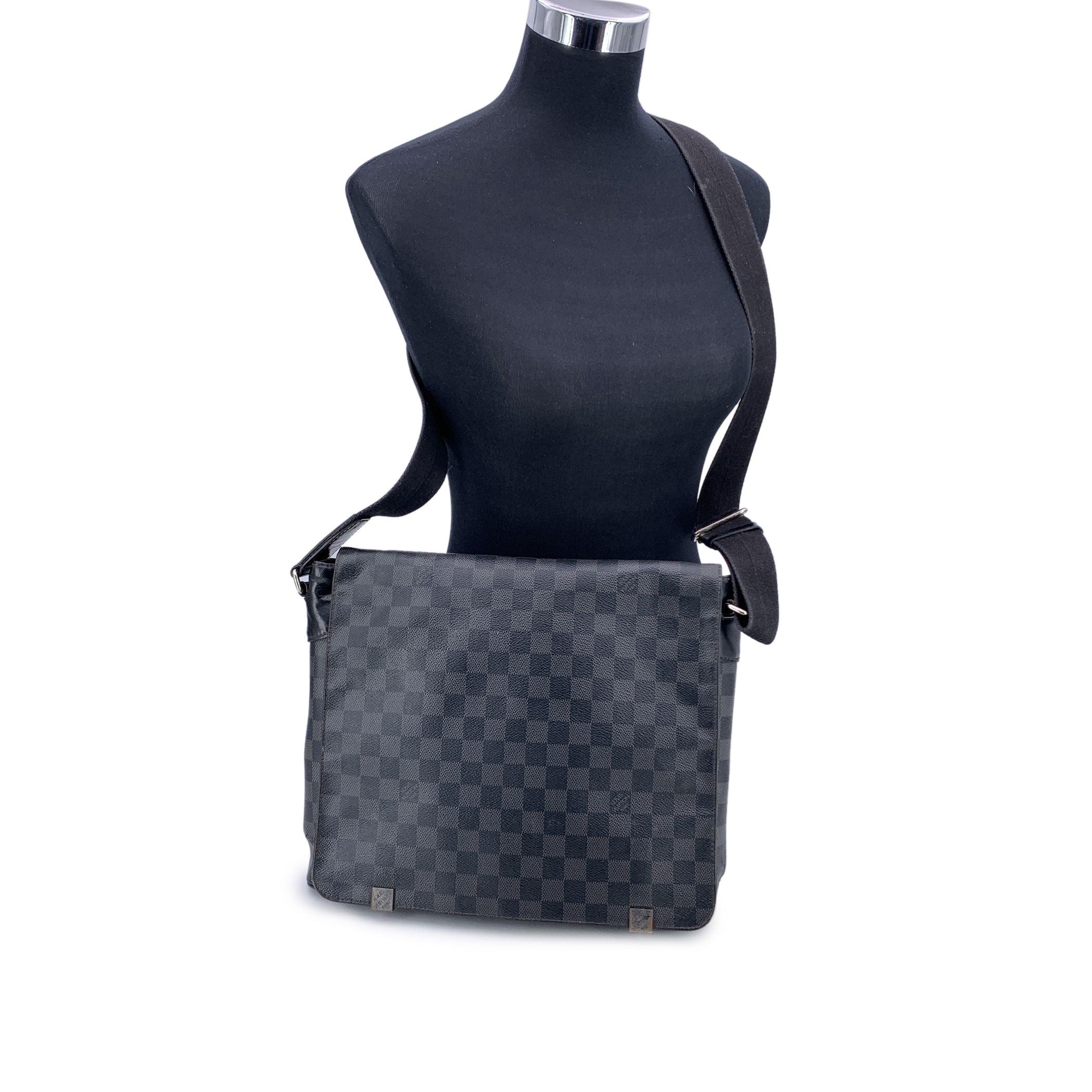 This beautiful Bag will come with a Certificate of Authenticity provided by Entrupy. The certificate will be provided at no further cost. Discover the timeless elegance and versatility of the Louis Vuitton Damier Graphite District MM Messenger Bag,