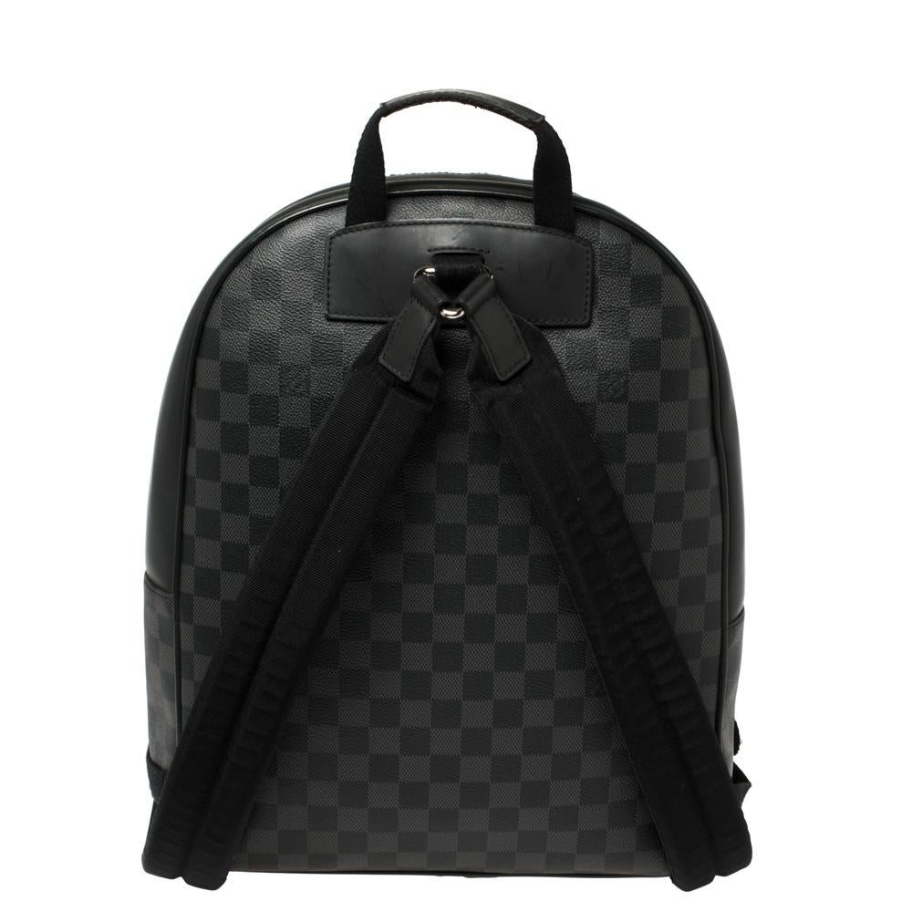 This stylish Josh backpack from Louis Vuitton is made from the signature Damier Graphite canvas and leather and is enhanced with a zipped pocket at the front. The bag features a top handle and two shoulder straps. It has a spacious interior that is