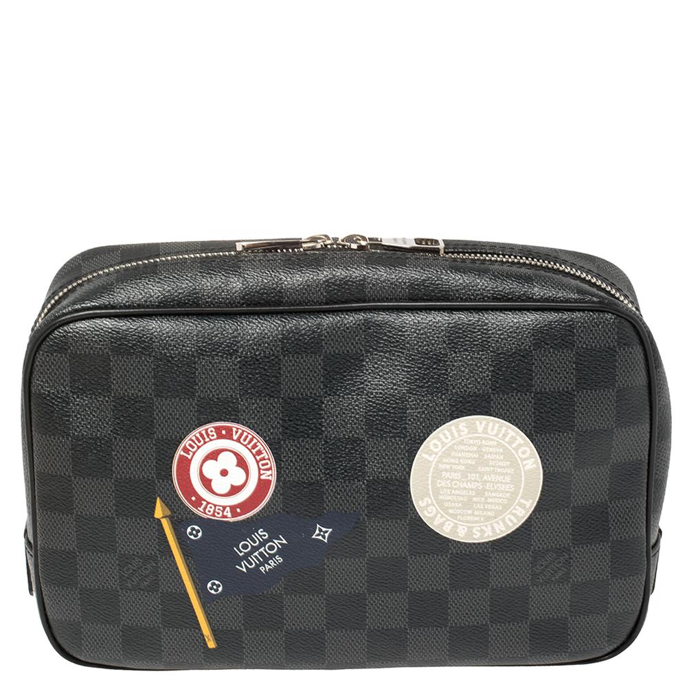 This toilet pouch from Louis Vuitton crafted using Damier Graphite canvas is an ideal choice for everyday use or while traveling. It is a highly convenient pouch with an exterior decorated with distinct patches and a zip closure to secure the