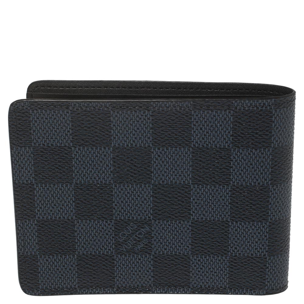 This Malletier Paris 1854 wallet from Louis Vuitton has the instant look of luxury. It is crafted from Damier Graphite canvas as well as black leather and designed with multiple slots and compartments for your cards and bills.

Includes: Original