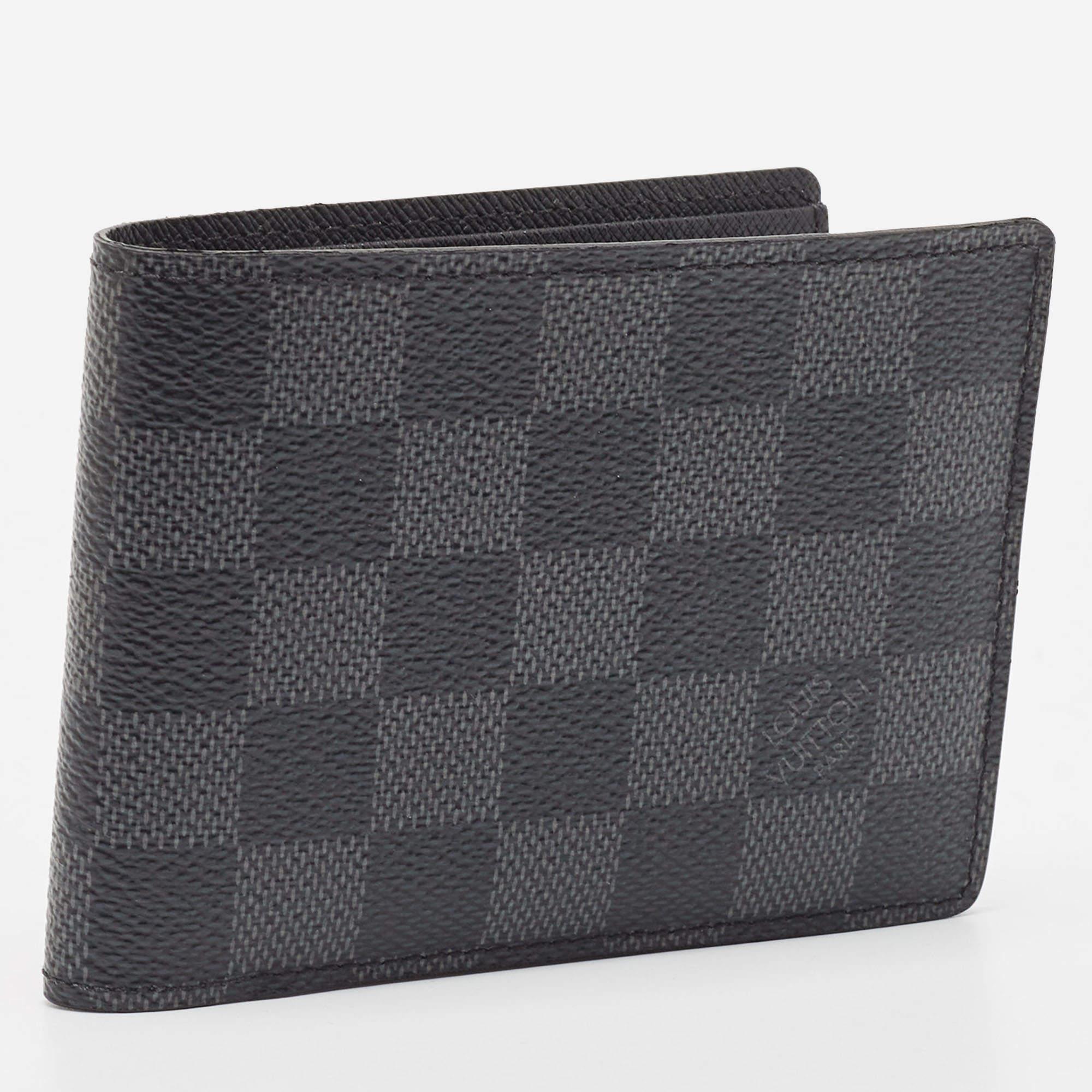 Designed in a slender silhouette that makes it fit in most pockets, this Louis Vuitton bifold wallet is crafted with signature Damier Graphite canvas. It is equipped with multiple card slots and compartments for your cards, receipts and currency.

