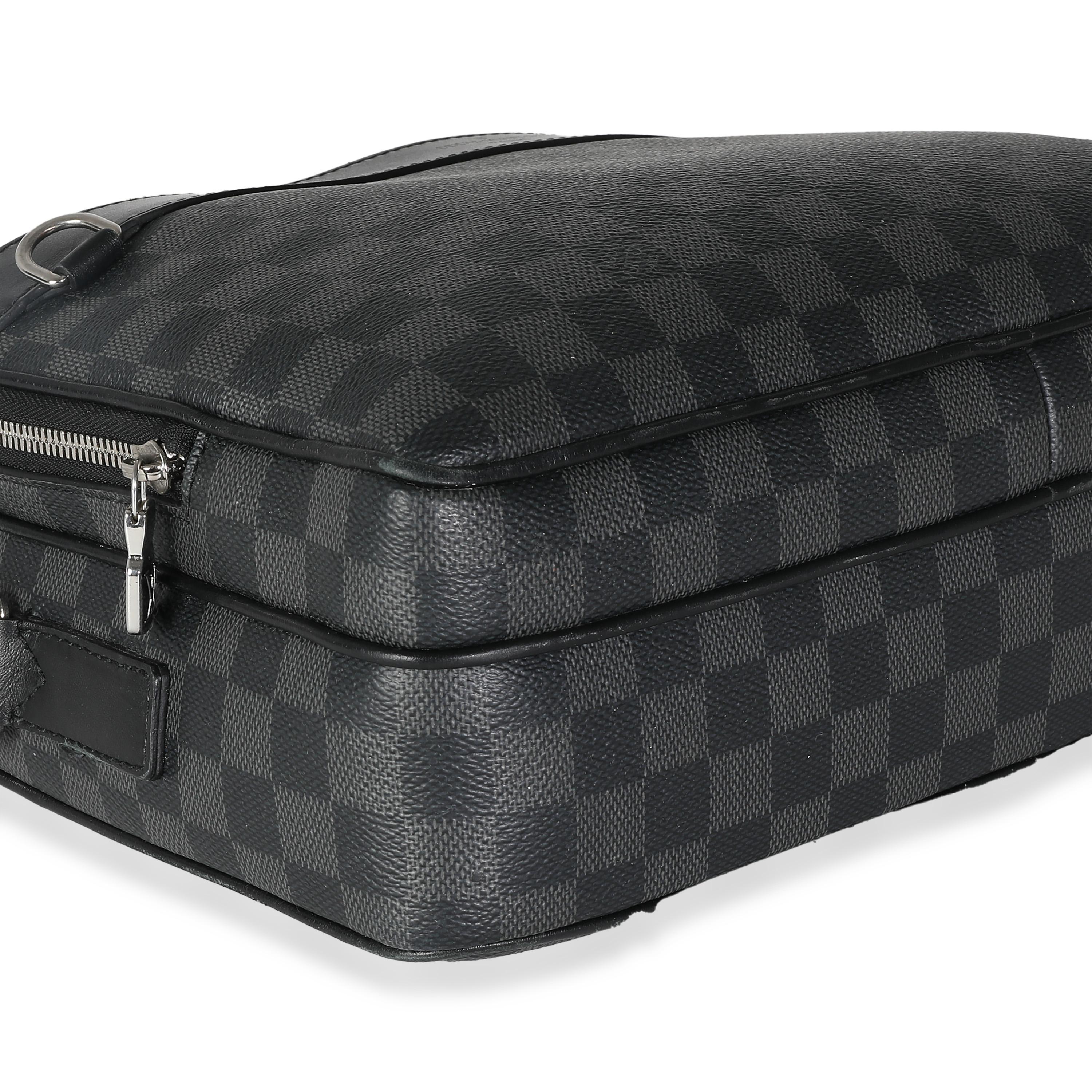 Listing Title: Louis Vuitton Damier Graphite Canvas Trocadero MM
SKU: 139341
Condition: Pre-owned 
Handbag Condition: Good
Condition Comments: Item is in good condition with apparent signs of wear.  Moderate scuffing and peeling along corners and