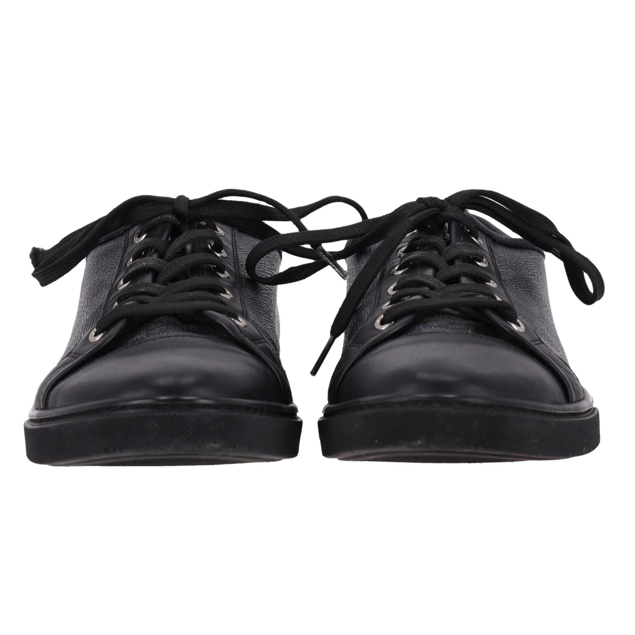 Louis Vuitton Damier Graphite Coated Canvas & Leather Sneakers

Grey low-top sneakers crafted from LV's signature Damier graphite coated canvas with black leather round toe.

Featuring lace-up front and 'Louis Vuitton Paris' leather patch to the