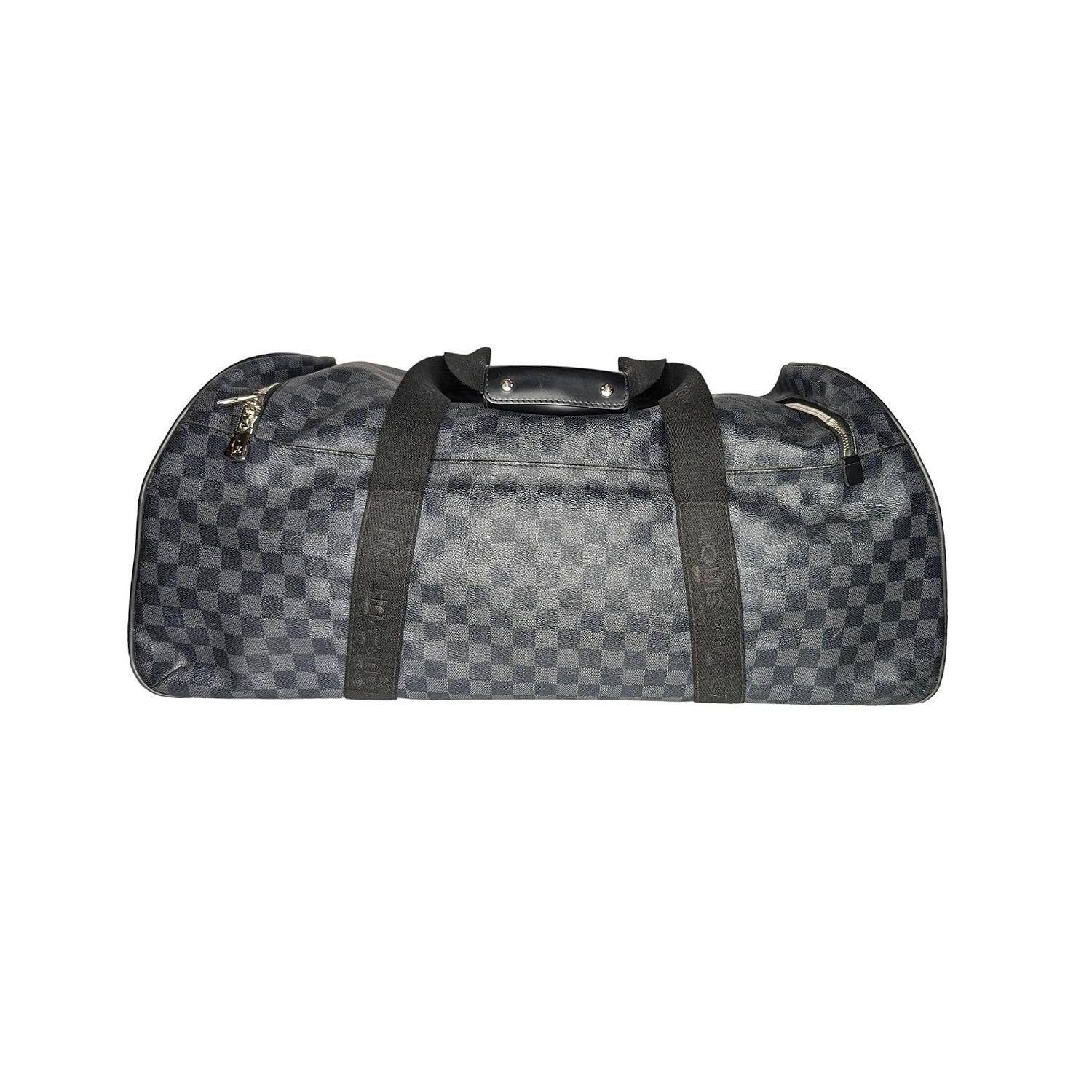 The Louis Vuitton Damier Graphite Canvas Neo Eole 65 Rolling Duffle Bag is named after the Greek god and is the ideal weekend bag. Features spacious interior, anti-skid wheels on one side, dual canvas top handles and a hidden retractable