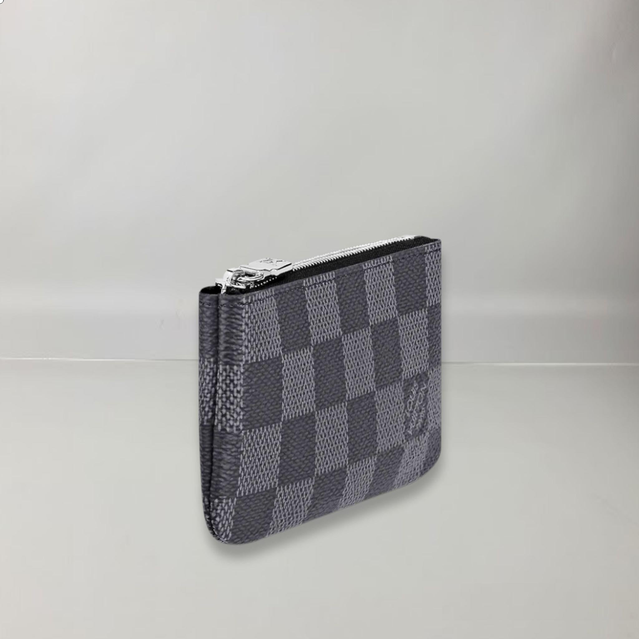 Checkered Graphite Canvas, Cowhide lining, Silver metallic finishes, zipper, Keychains and chain with hook