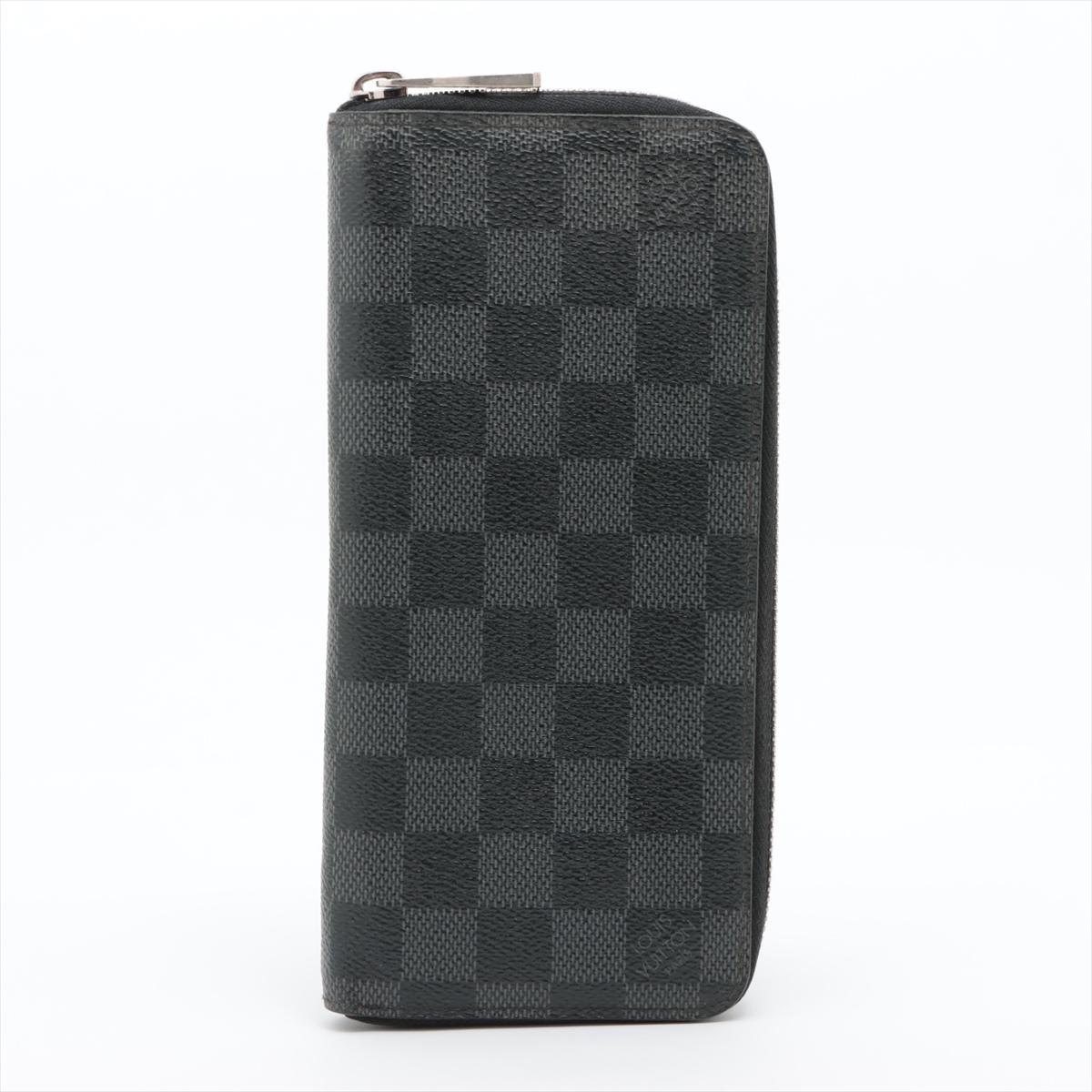 The Louis Vuitton Damier Graphite Zippy Wallet Vertical is a sleek and sophisticated accessory that seamlessly combines style and practicality. Its appearance is defined by the iconic Damier Graphite canvas in classic black and gray tones, exuding a