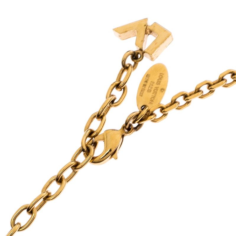 Exude charm with this lovely Louis Vuitton necklace. The gold-tone necklace is accented with a pendant comprising of a faux pearl and a signature motif. The chain link is fastened with a lobster clasp.

Includes: The Luxury Closet Packaging,