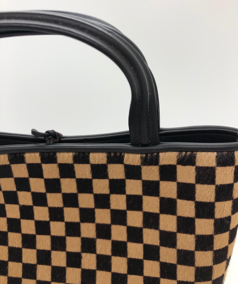 Louis Vuitton Pony-style calfskin handbag - ShopStyle Tote Bags