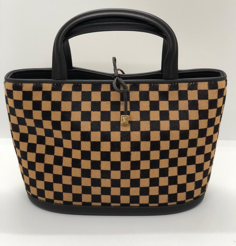 Louis Vuitton Pony-style calfskin handbag - ShopStyle Tote Bags
