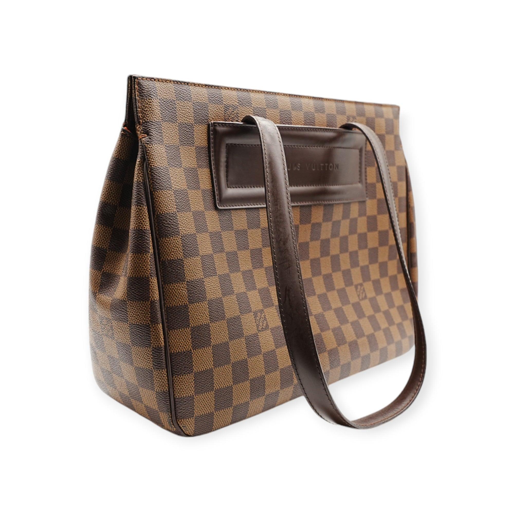 The Louis Vuitton ChessBoard Shoulder Bag features the iconic checkered pattern and a roomy interior, making it both stylish and highly functional. Perfect for those who need ample space without sacrificing elegance. 
 Remarks: signs of wear as