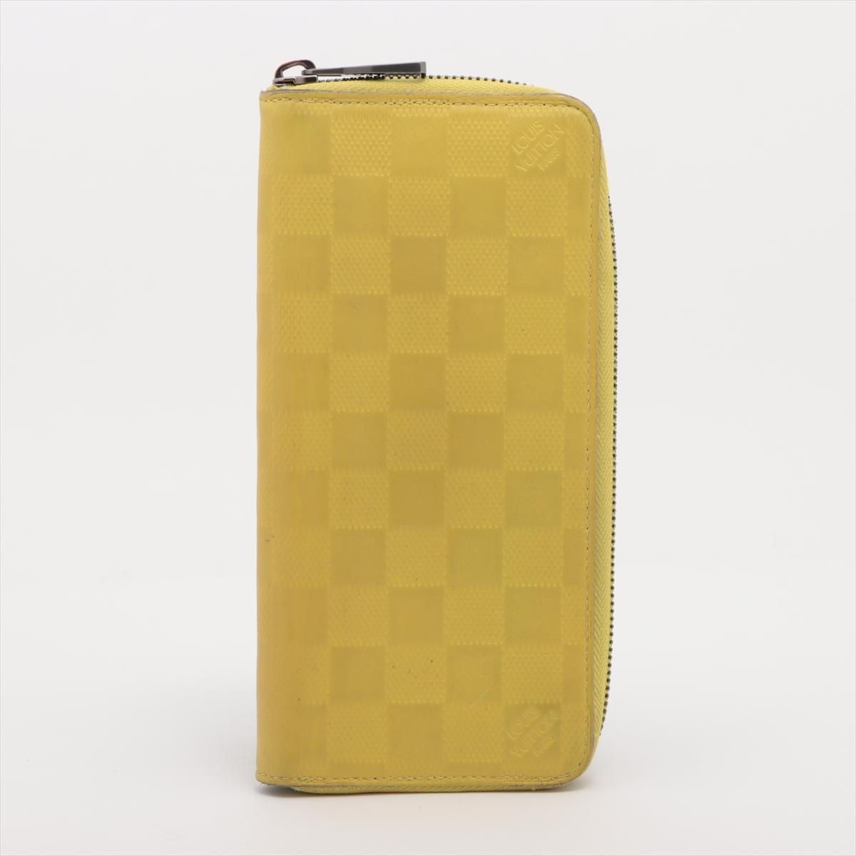 The Louis Vuitton Damier Verticals Zippy Wallet in Yellow is a bold and stylish accessory that blends luxury with functionality. Crafted from Damier coated canvas in a striking yellow hue, the wallet features a unique vertical check pattern for a