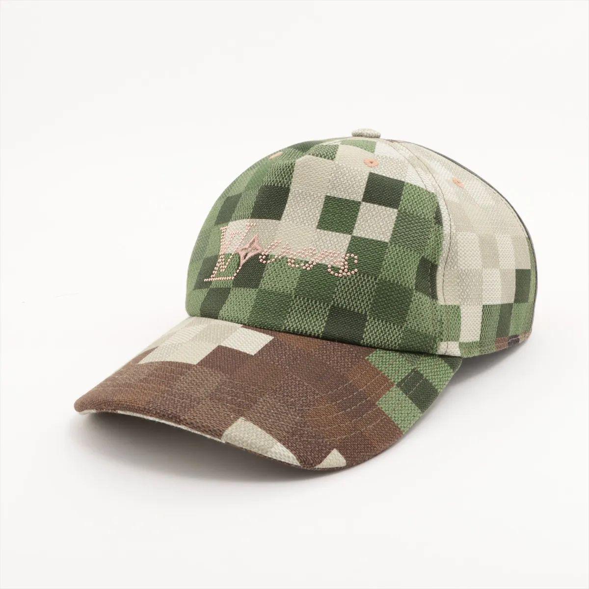 The Louis Vuitton Damoflage Cap is a bold and contemporary accessory that fuses streetwear edge with luxury craftsmanship. Featuring the distinctive Damoflage pattern—a creative blend of the iconic Damier motif and camouflag the cap stands out with