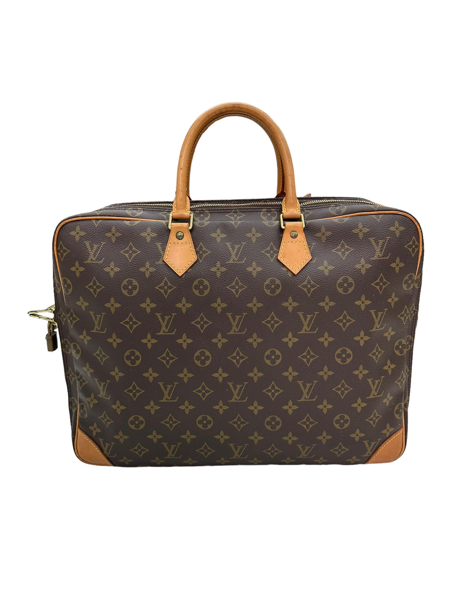 

Document Bag by Louis Vuitton, Dandy model, size GM, made of brown leather in the classic monogram pattern, with cowhide inserts and golden hardware. Divided into two compartments, each of them equipped with a zip closure. Fitted with two rigid