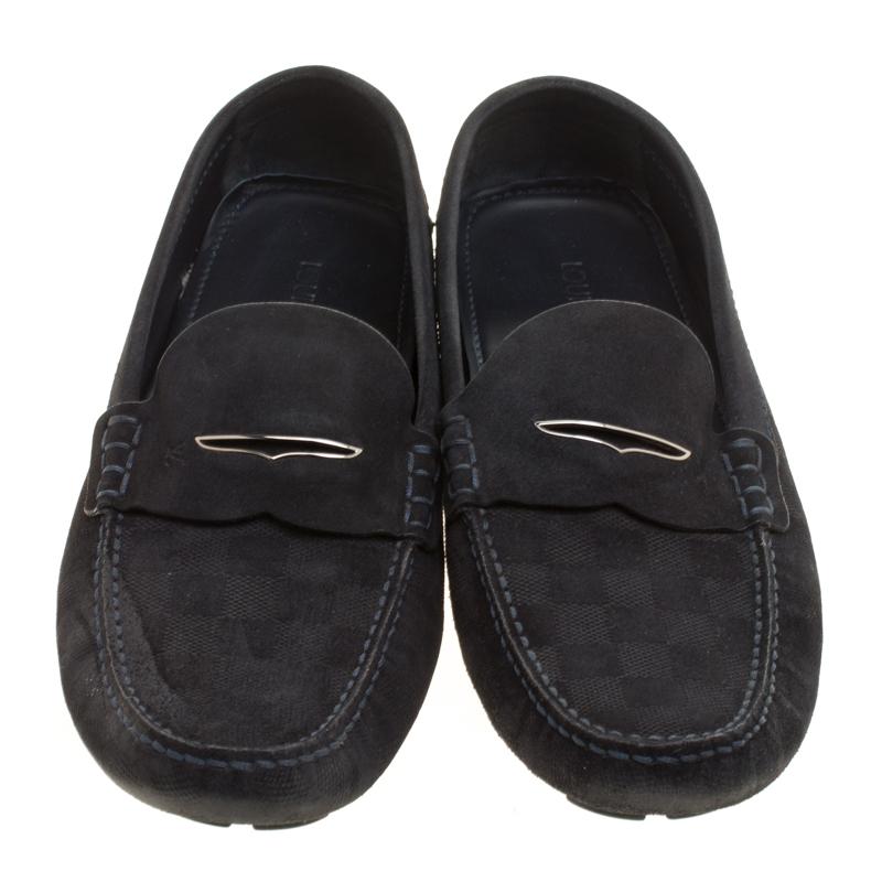 Stylish and super comfortable, this pair of loafers by Louis Vuitton will make a great addition to your shoe collection. They've been crafted from Damier-embossed suede and styled with Penny keeper straps. Leather insoles and rubber outsoles finely