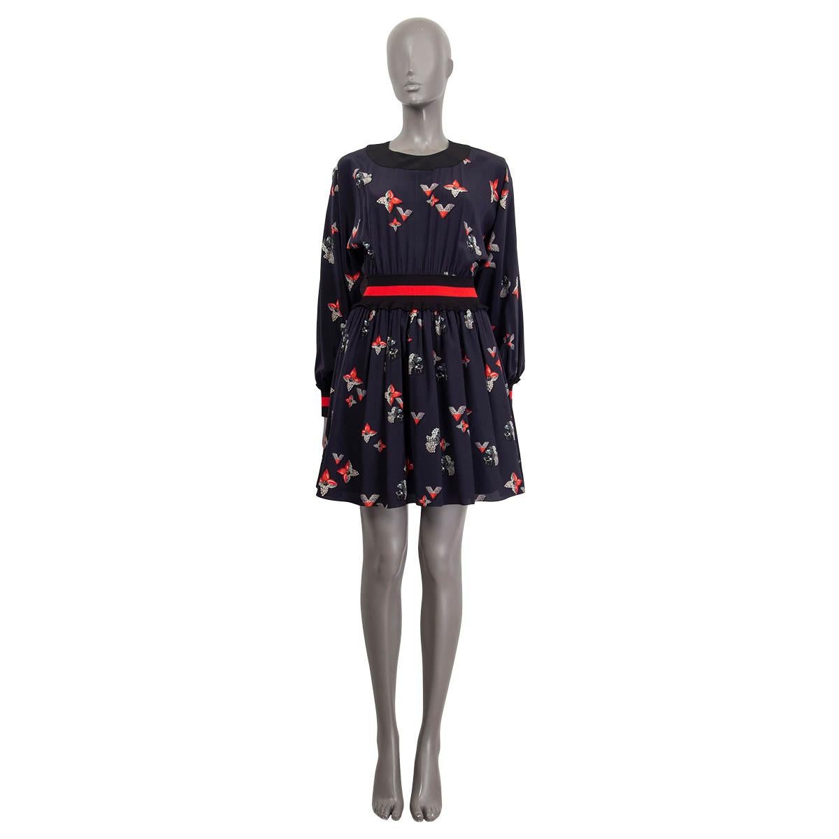 100% authentic Louis Vuitton dress in navy blue, red, silver and black silk (100%). Features a diamond logo print and long raglan sleeves (sleeve measurements taken from the neck). Opens with two buttons at the back. Lined in black viscose (71%),