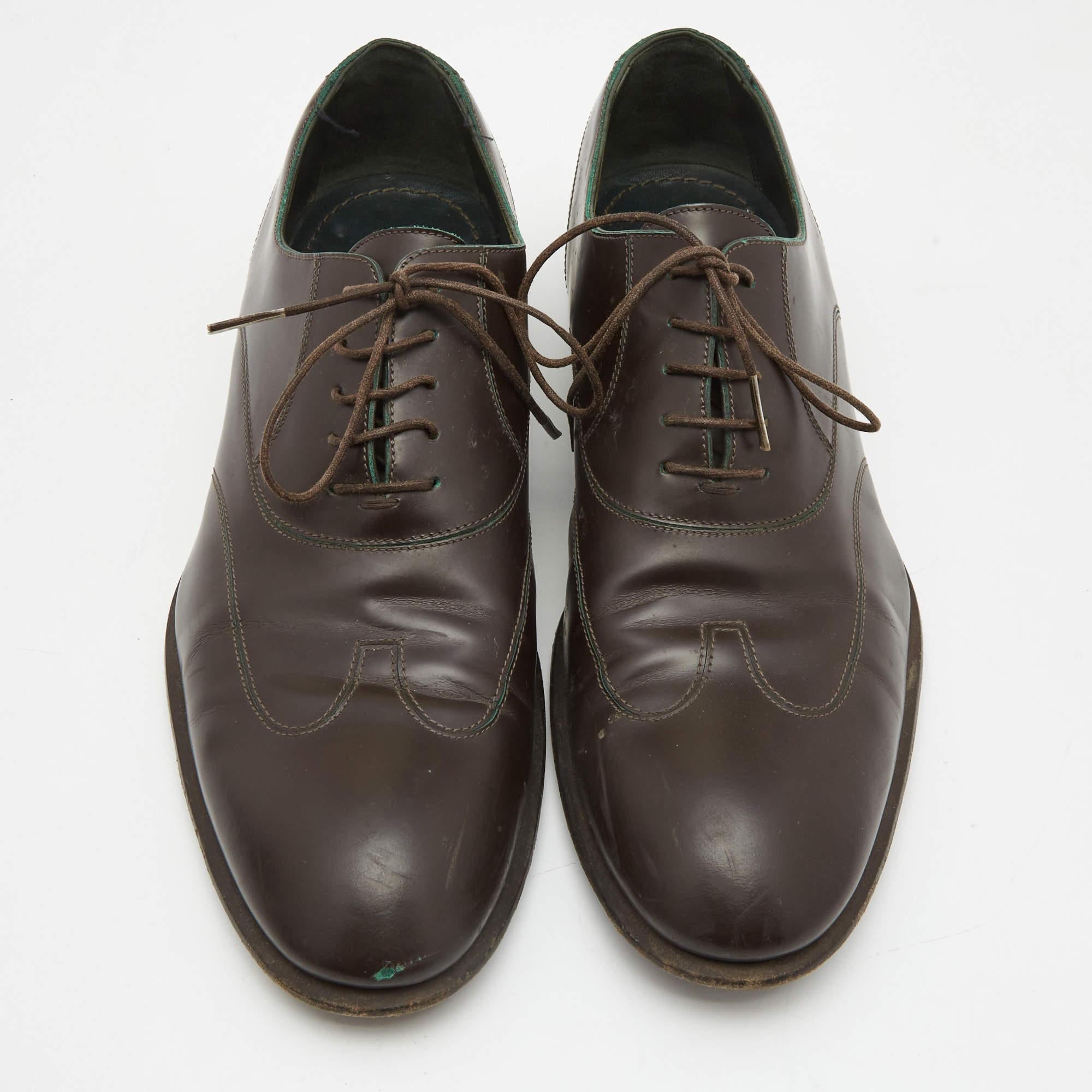 These well-crafted designer shoes have got you covered for office and weekend plans. They are by Lous Vuitton, fashioned in dark brown leather, and secured with laces.

