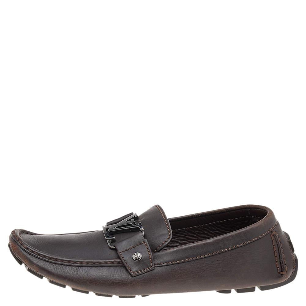 Look sharp and neat with this pair of Monte Carlo loafers from Louis Vuitton. They have been crafted from dark brown leather and designed with the art of fine stitching and the signature LV on the uppers. The pair is complete with comfortable