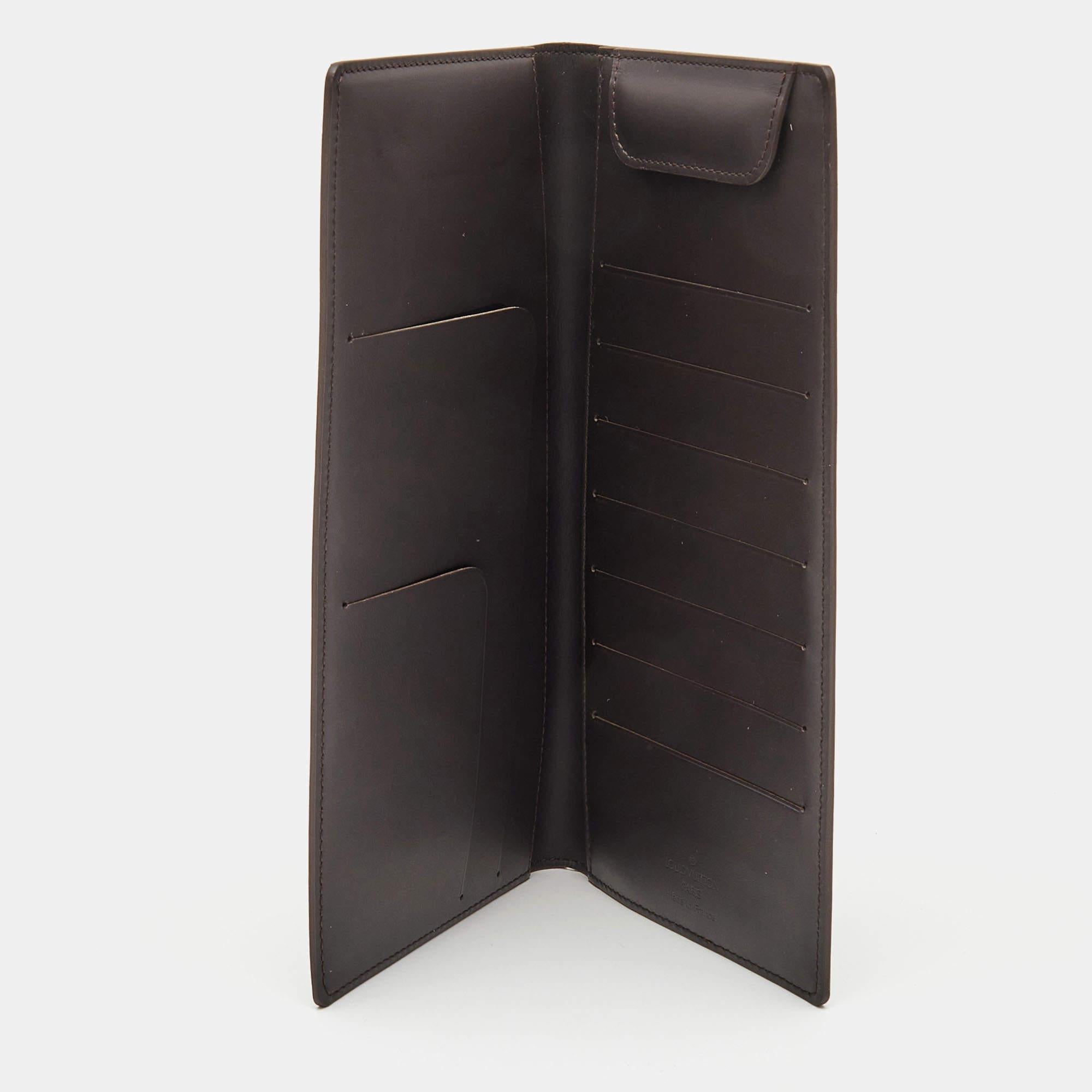 The Louis Vuitton organizer is a luxurious accessory. Crafted from dark brown monogram leather, it features a classic bifold design with multiple card slots, a bill compartment, and an organized interior, making it a stylish and functional essential