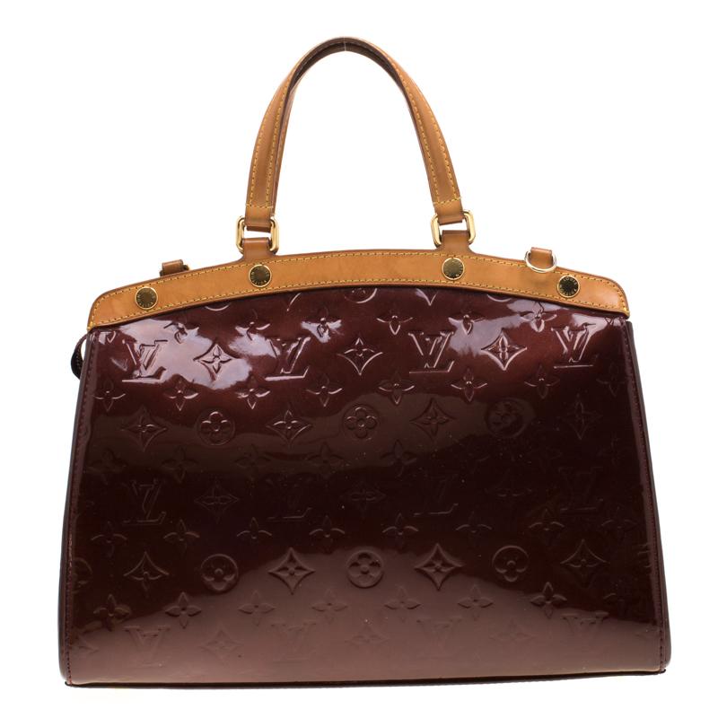 The feminine shape of Louis Vuitton's Brea is inspired by the doctor's bag. Crafted from the iconic Monogram Vernis the bag has a perfect finish. The fabric interior is spacious and it is secured by a zipper. The bag features double handles,