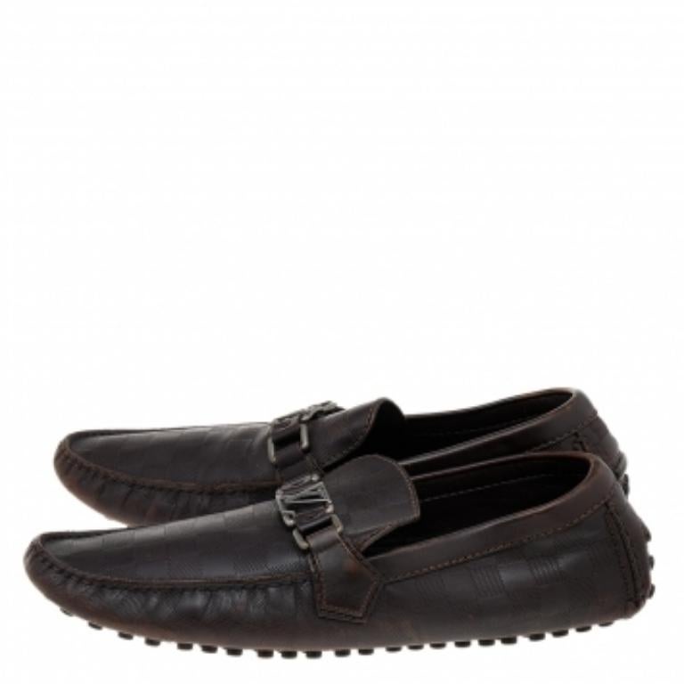 Loafers like these ones from Louis Vuitton are worth every penny because they epitomize both comfort and style. These Hockenheim loafers are made from dark-brown Damier embossed leather on the exterior with a silver-toned logo accent decorating